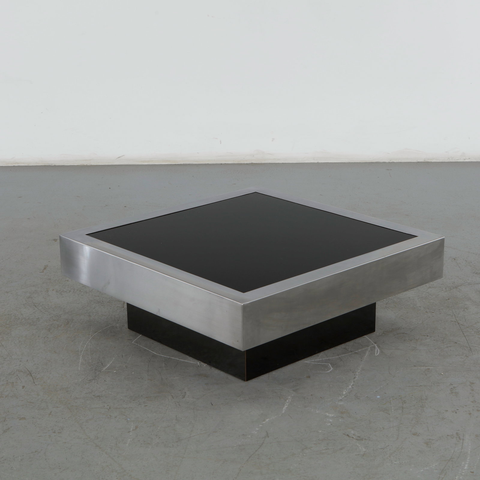 Willy Rizzo for Cidue, Square Glass and Stainless Steel Coffee Table, 1970s: Designed by the legendary Italian-French designer Willy Rizzo and manufactured in Italy, this table perfectly captures the bold, ultra-luxurious aesthetic of the Hollywood Regency and Mid-Century