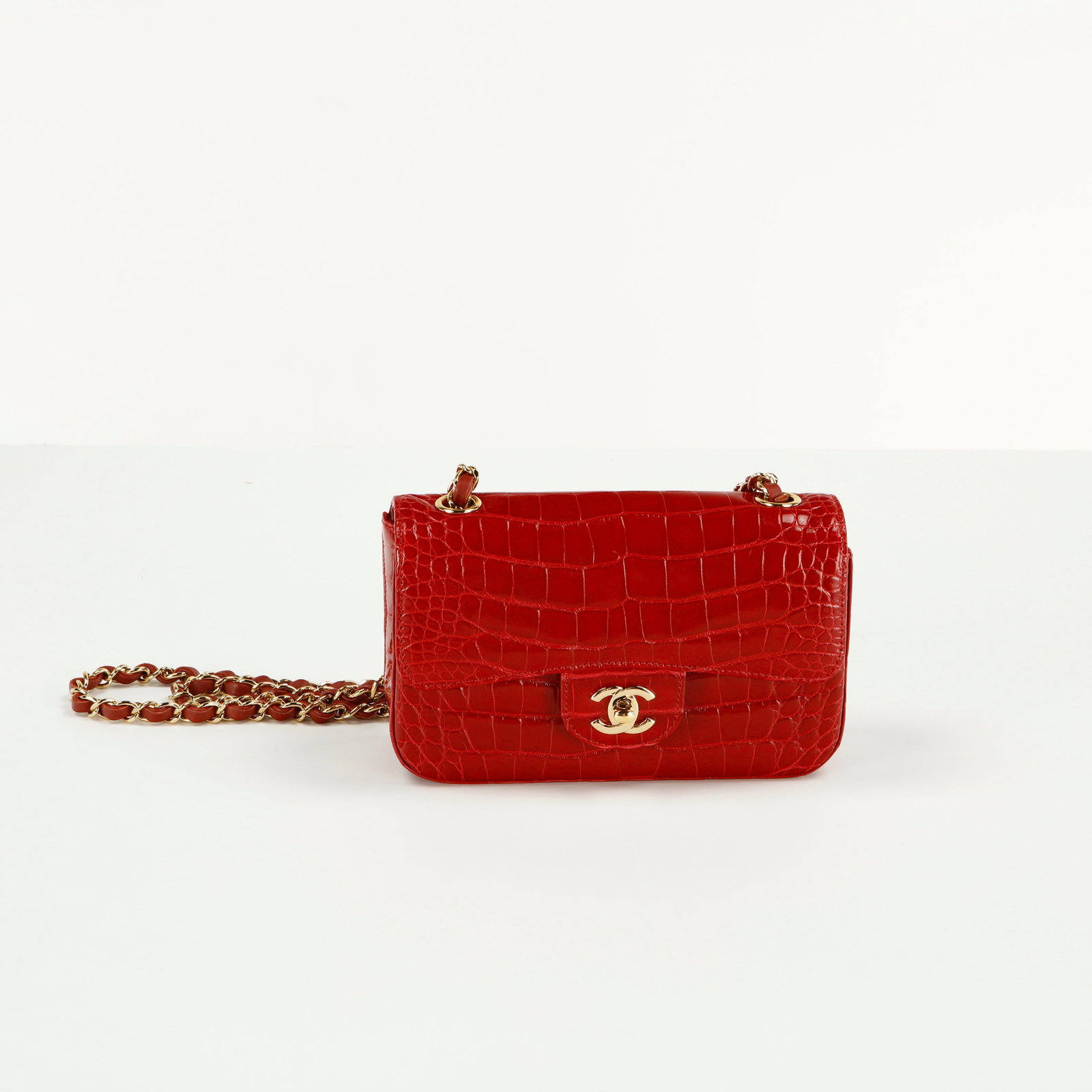 Chanel, Red Alligator Classic Flap Bag: This Chanel Classic Mini Square Flap Bag in red shiny alligator with gold hardware is an ultra-rare, top-tier collector's holy grail. Following Chanel's decision to discontinue the production 