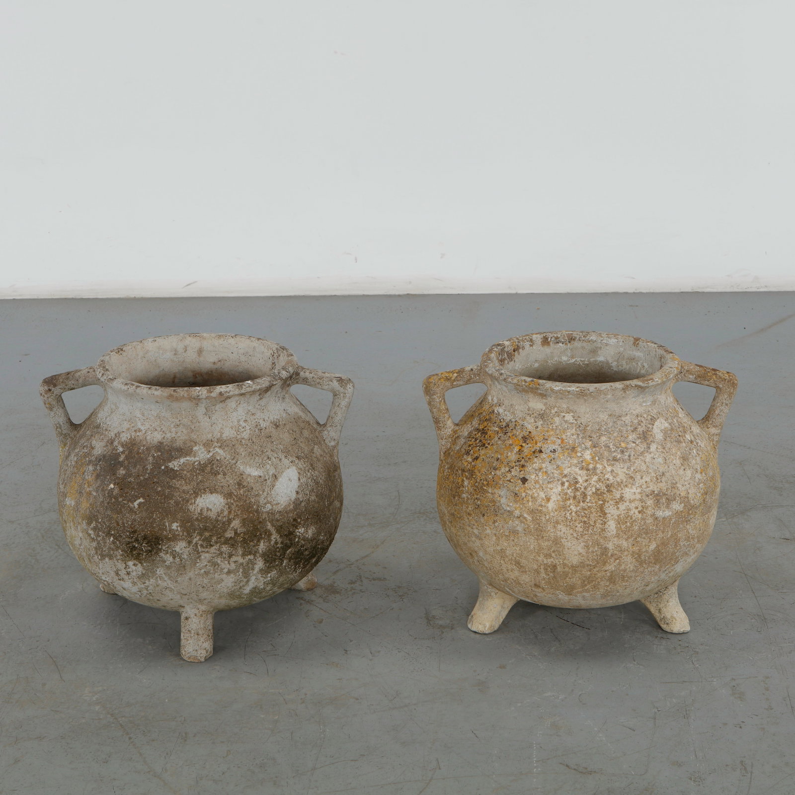 Willy Guhl, Pair of Cauldron Planters, 1960s: Rare cauldron planters by Willy Guhl, with rounded vessel-like shapes and strong sculptural presence. Aged surface adds rustic charm. Opening Diameter: 11.5 in. Overall Diameter: 21 in. Height: 18 in.