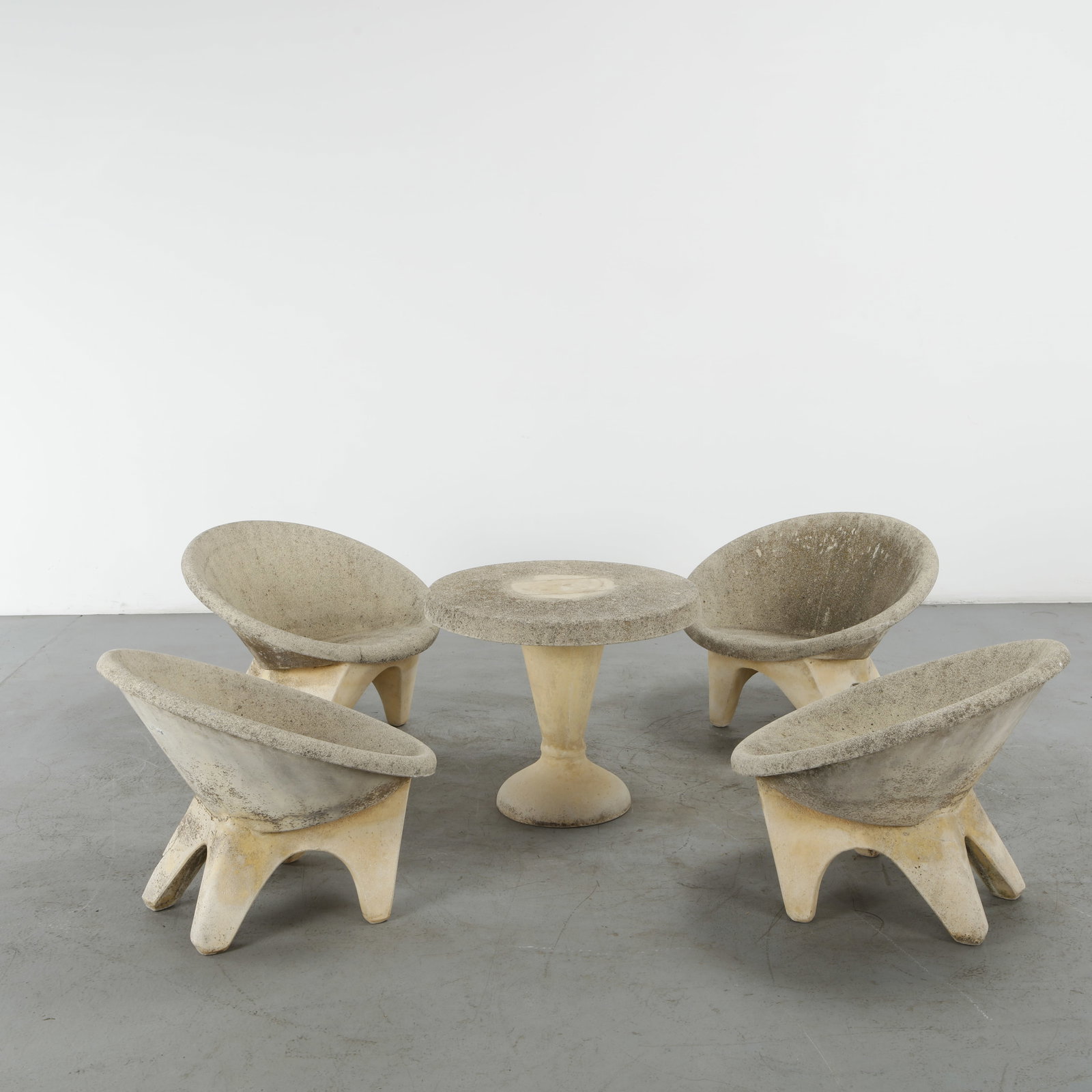 French Concrete Garden Dining Set, 1960s: This five-piece mid-century modern concrete garden dining set features an exceptional space-age, organic design. This sculptural patio collection beautifully balances minimalist forms with durable,
