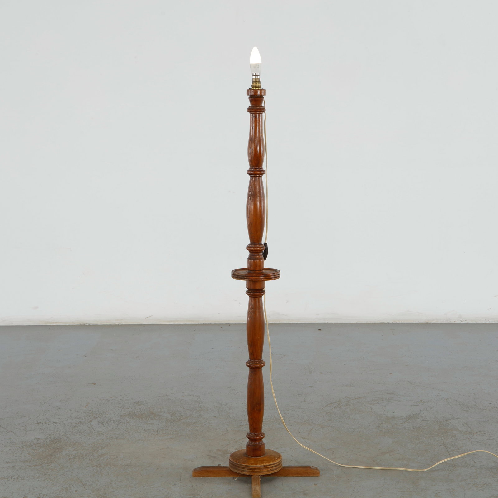 Charles Dudouyt, Turned Wood Floor Lamp, 1940s: This floor lamp with an integrated drink table is an excellent example of 1940s French modernist design. Unlike the typical solid, heavy wood discs found on most Dudouyt pieces, this variant features