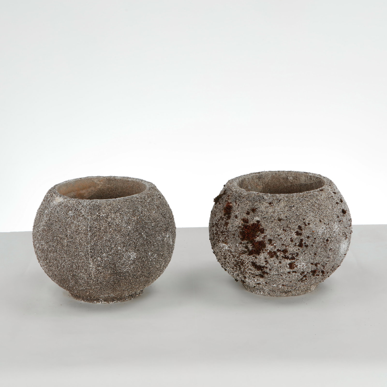 Grandon Fres, Pair of Spherical Planters, 1960s: Pair of spherical planters with textured surface. Sculptural outdoor statement pieces by Grandon Fres. Height: 9.5 in. Diameter: 10 in. Opening Diameter: 7 in. Condition Wear