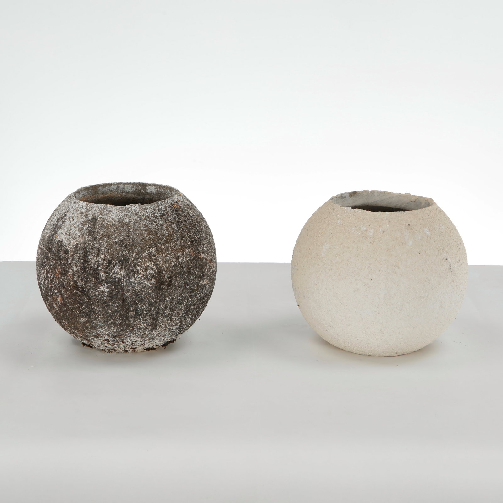 Grandon Fres, Pair of Spherical Planters, 1960s: Pair of spherical planters with textured surface. Sculptural outdoor statement pieces by Grandon Fres. Height: 9 in. Diameter: 10 in. Opening Diameter: 5.5 in. Condition Wear