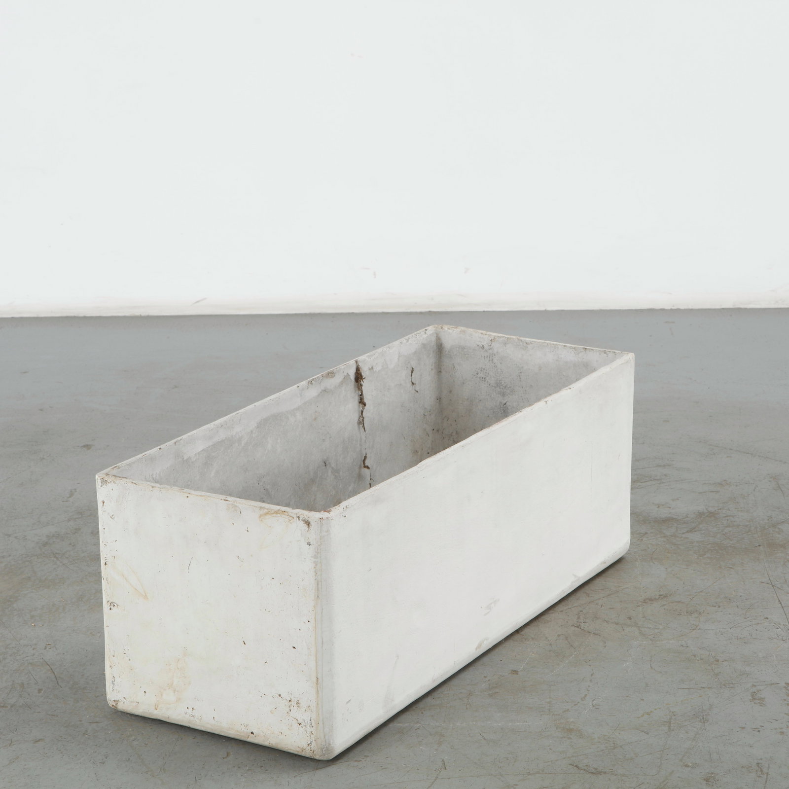 Willy Guhl, Large Rectangular Planter, 1960s: Classic rectangular Eternit planter designed by Willy Guhl. Timeless Swiss design with natural patina from outdoor use. Height: 15 in. Length: 39 in. Width: 16 in. Condition Wear commens