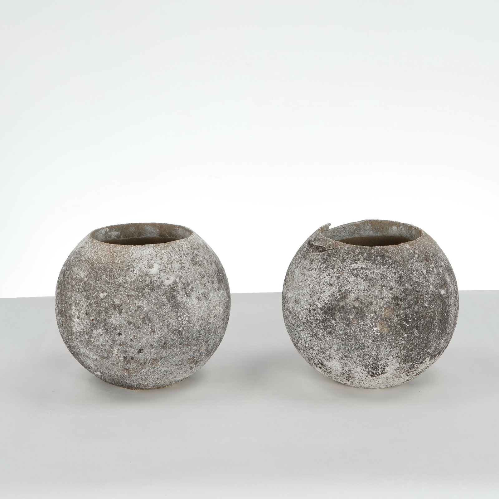 Grandon Fres, Pair of Spherical Planters, 1960s: Pair of spherical planters with textured surface. Sculptural outdoor statement pieces by Grandon Fres. Height: 9.5 in. Diameter: 10 in. Opening Diameter: 6 in. Condition Wear