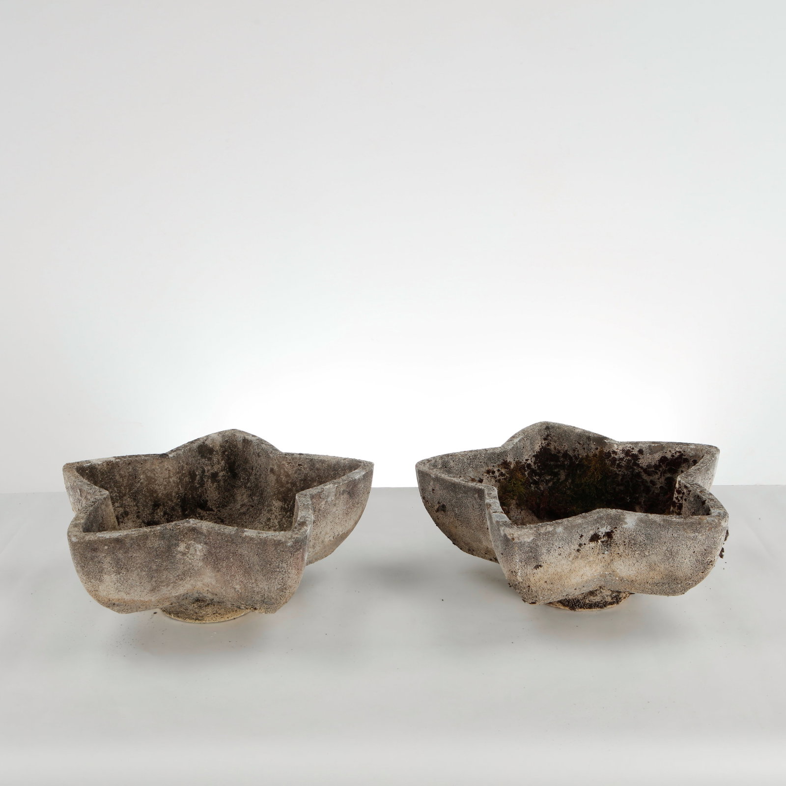 Pair of Limestone Star Planters, 1960s: Vibrant pair of star-shaped cement planters. A standout mid-century garden accent from the 1960s. Height: 7 in. Length: 16 in. Width: 18.5 in. Condition Wear commensurate with age and