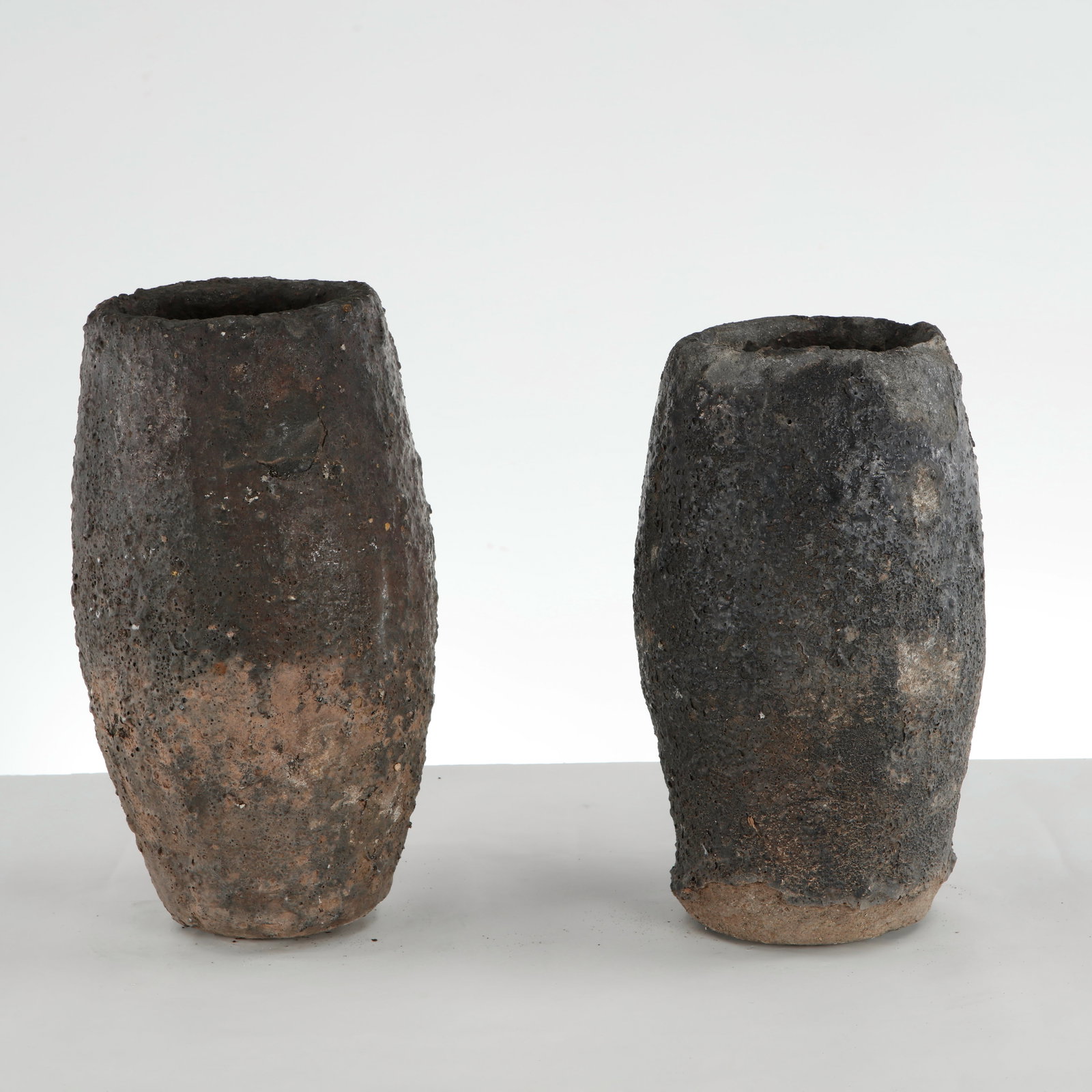 Pair of Small Foundry Planters, 1960s: This pair of vintage industrial foundry crucible planters is an exceptional example of utilitarian object design repurposed as striking, sculptural garden or indoor vessels. 1: Height: 17.5 in. Diamet