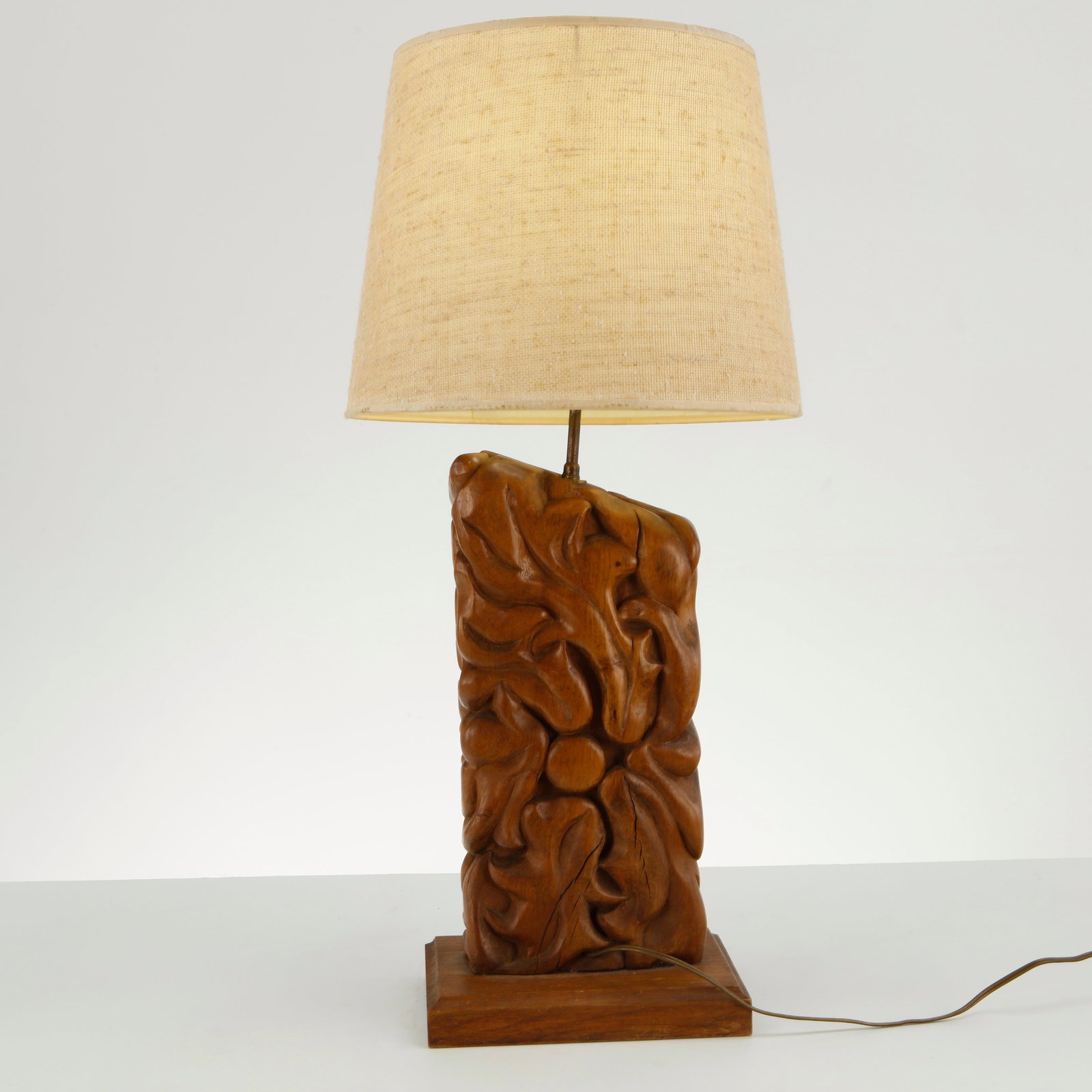 Carved Wood Floral Table Lamp, 1960s: This vintage hand-carved wood table lamp is an excellent example of mid-century Folk Art and Brutalist craft, likely dating to the 1960s or 1970s. The piece is highly valued for its raw material hones