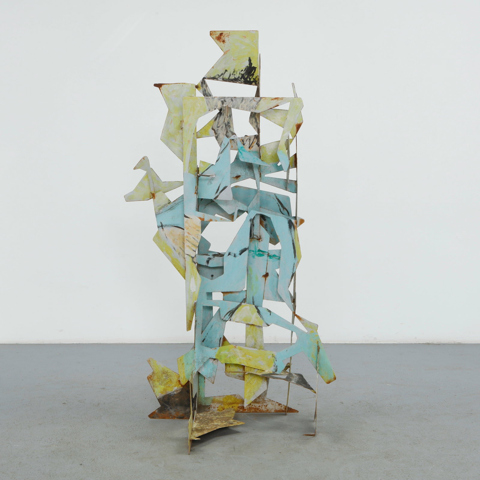 Coquelin, Abstract Metal Sculpture, 1980s: Constructed from cut and painted steel, this vertical sculpture assembles interlocking angular and curved planes in tones of yellow and turquoise over a rusted ground. The layered, gestural compositio