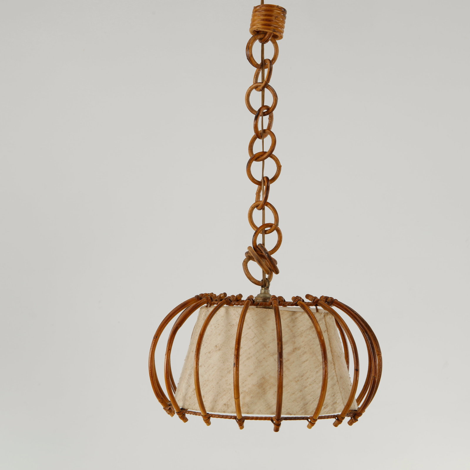 Louis Sognot, Rattan Round Pendant Lamp, 1950s: This pendant chandelier or hanging lamp by Louis Sognot is a quintessential piece of 1960s French mid-century modern design. Combining organic, bohemian materials with rigorous structural form, it bea