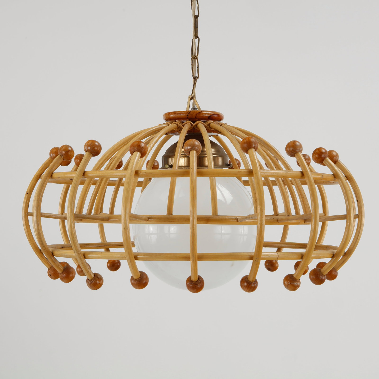 Louis Sognot, Rattan Chandelier with Ball Finials, 1960s: This piece by Louis Sognot stands out as an exceptional "space-age bohemian" crossover piece, blending strict geometric kinetic lines with natural materials. Not tested. Height: 18.5 in. Dia
