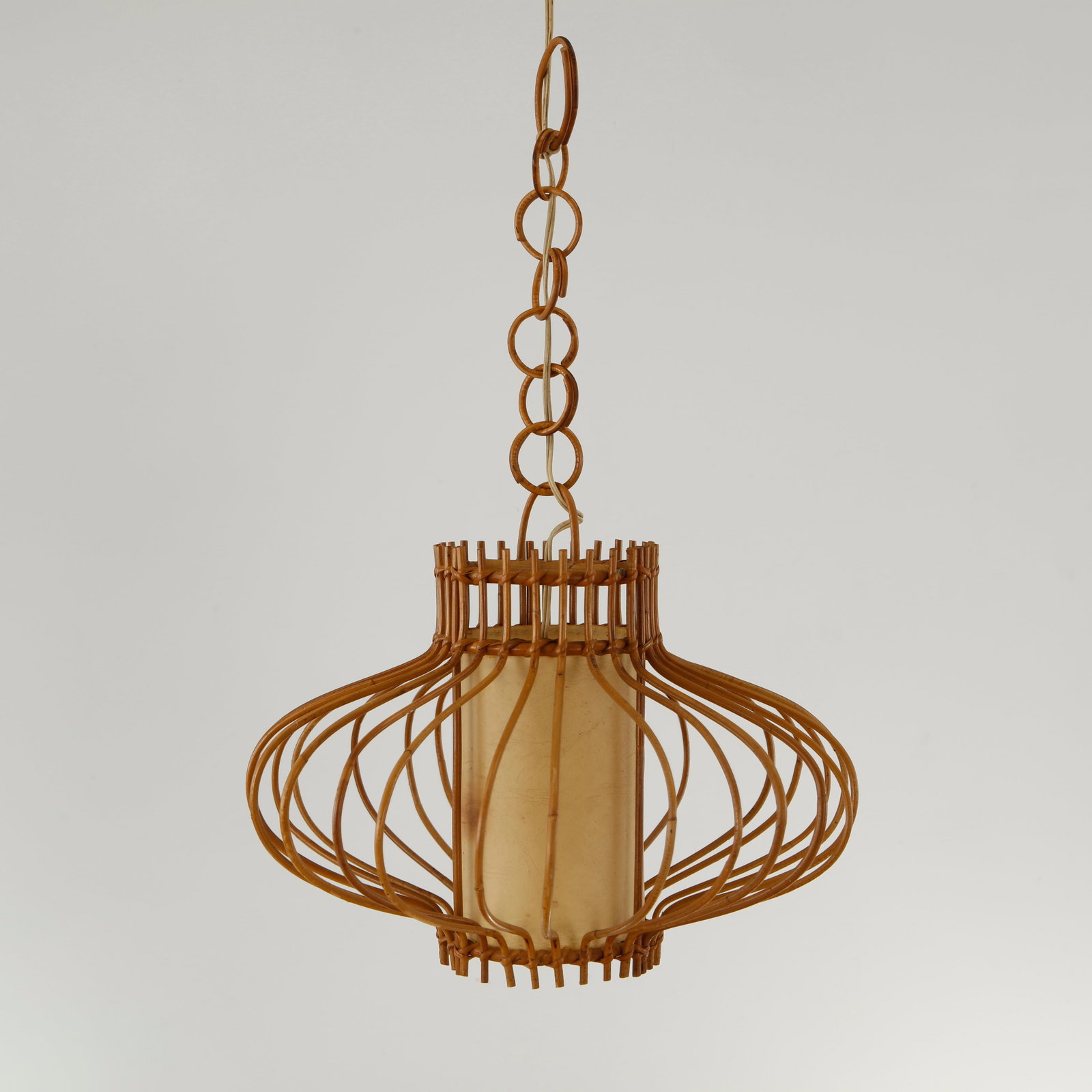 Louis Sognot, Sculptural Rattan Pendant Lamp, 1950s: A rare example of Sognot organic lighting designs inspired by Riviera craftsmanship. Not tested. Height: 26 in. Diameter: 16 in. Condition Good vintage condition. Wear commensurate with 