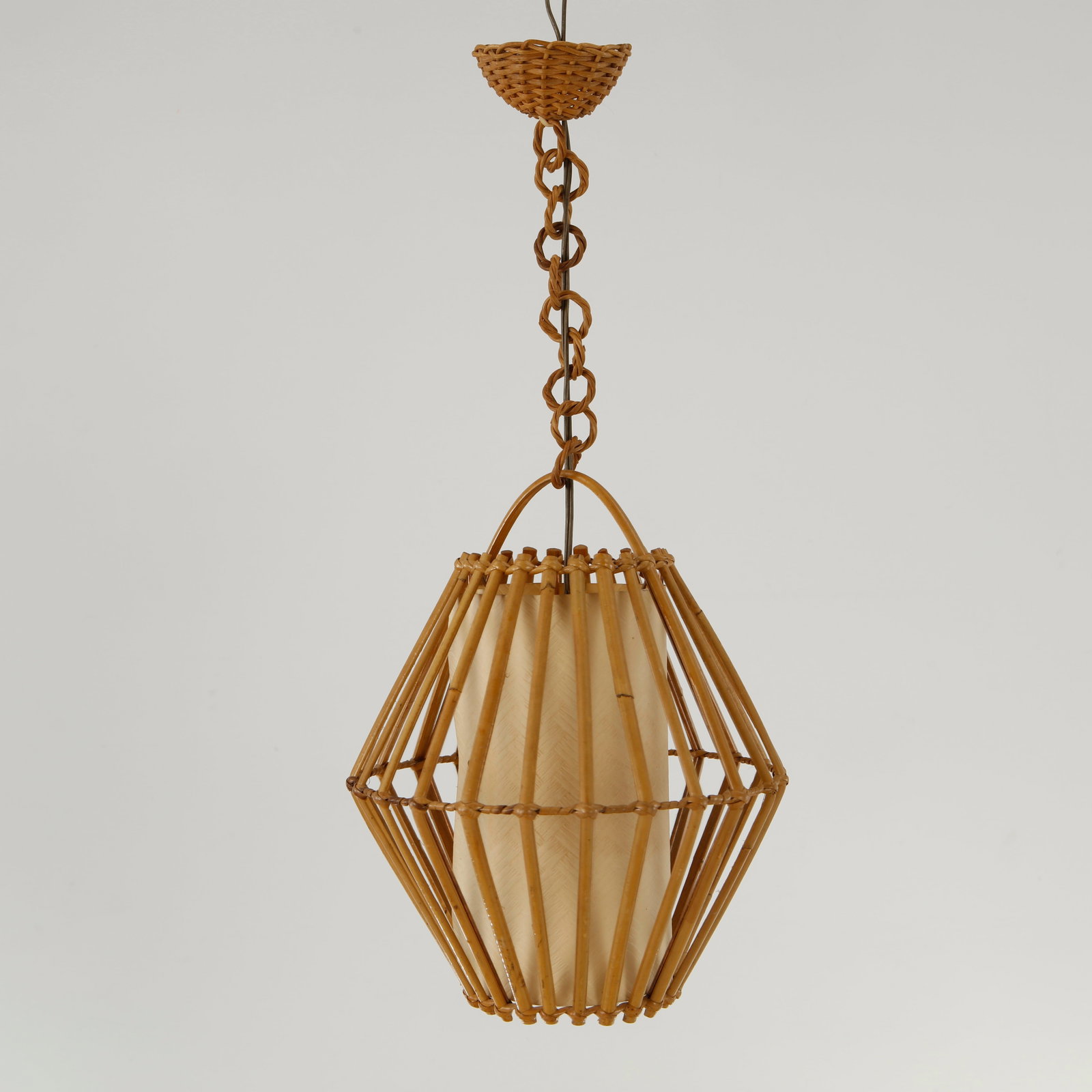 Louis Sognot, Geometric Rattan Pendant Lamp, 1950s: A suspended lantern featuring an intricate bamboo framework surrounding a parchment diffuser. A rare example of Sognot organic lighting designs inspired by Riviera craftsmanship No electronic disposal
