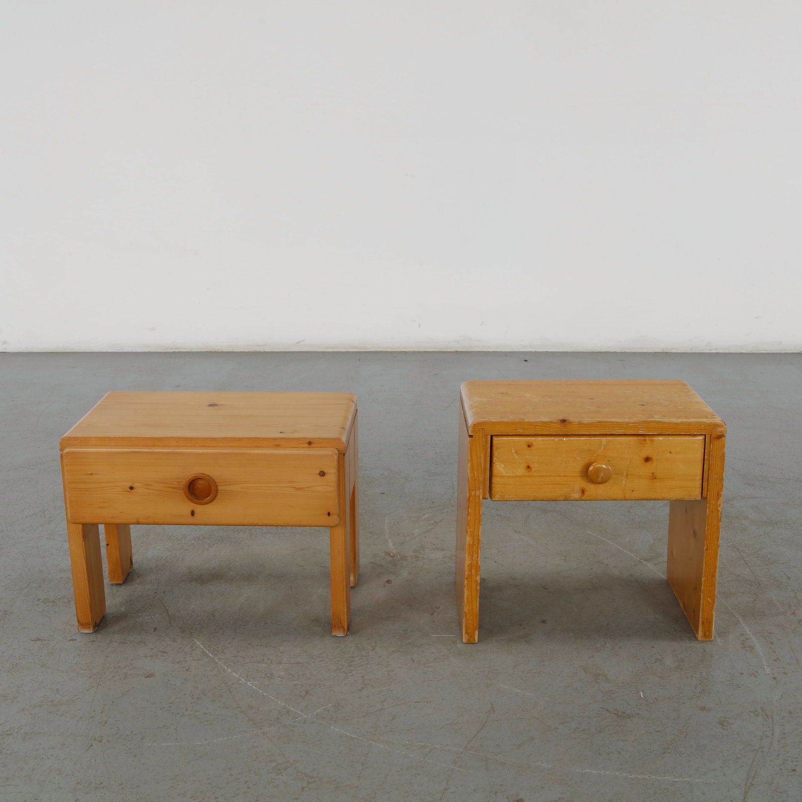 Charlotte Perriand for Les Arcs 1600, Pair of Pine Nighstands, 1960s: This pair of solid pine nightstands is an authentic example of French mid-century chalet furniture, famously selected and styled by pioneer architect and designer Charlotte Perriand for the Les Arcs s