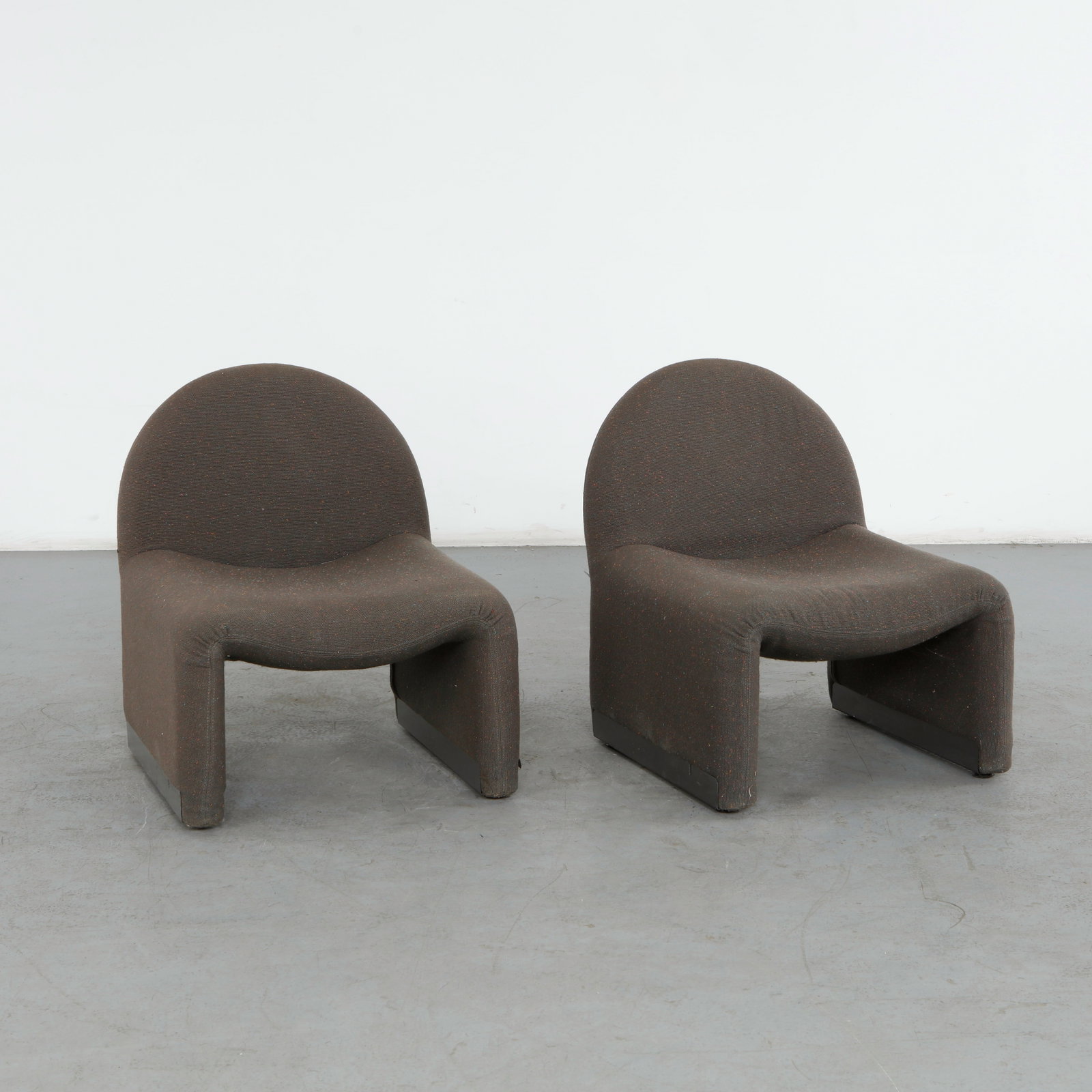 Pair of Grey Fabric Chairs in the style of Giancarlo Piretti, 1960s: Designed in the style of a celebrated Italian modernist master Giancarlo Piretti this pair of chairs represents an iconic achievement in space age and mid-century modern furniture design. Height: 27 i