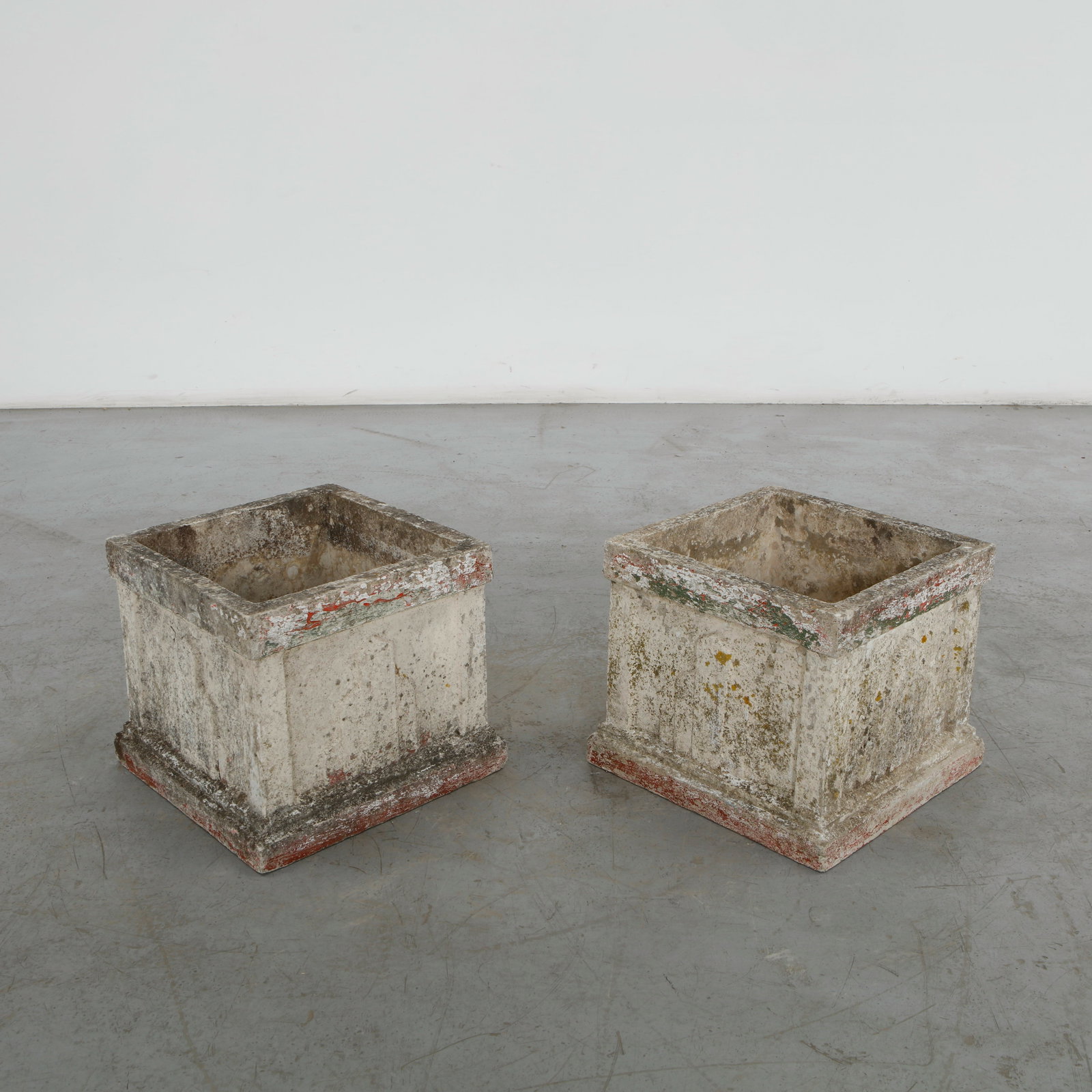 Pair of French Square Concrete Planters, 1960s: This pair of mid-century French concrete garden planters features a rugged, architectural design characterized by a structural square silhouette. Height: 13 in. Length: 14.25 in. Width: 14.25 in. &nbs
