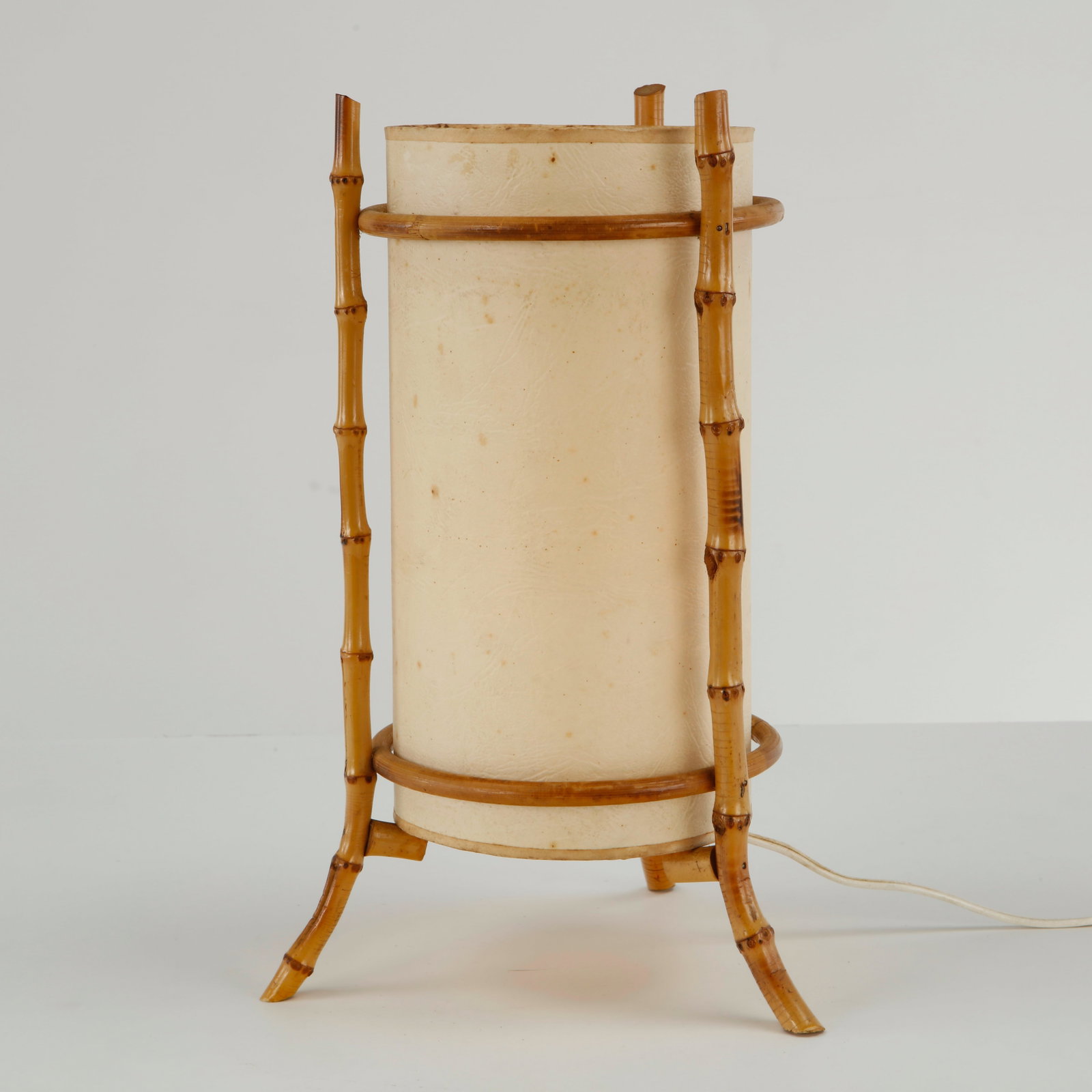 Louis Sognot, Rattan Table Lamp, 1960s: This bamboo table lamp by Louis Sognot is a beautifully minimalist example of 1960s French modern design. Working. European Plug. Height: 13 in. Diameter: 8 in. Condition Good vintage co