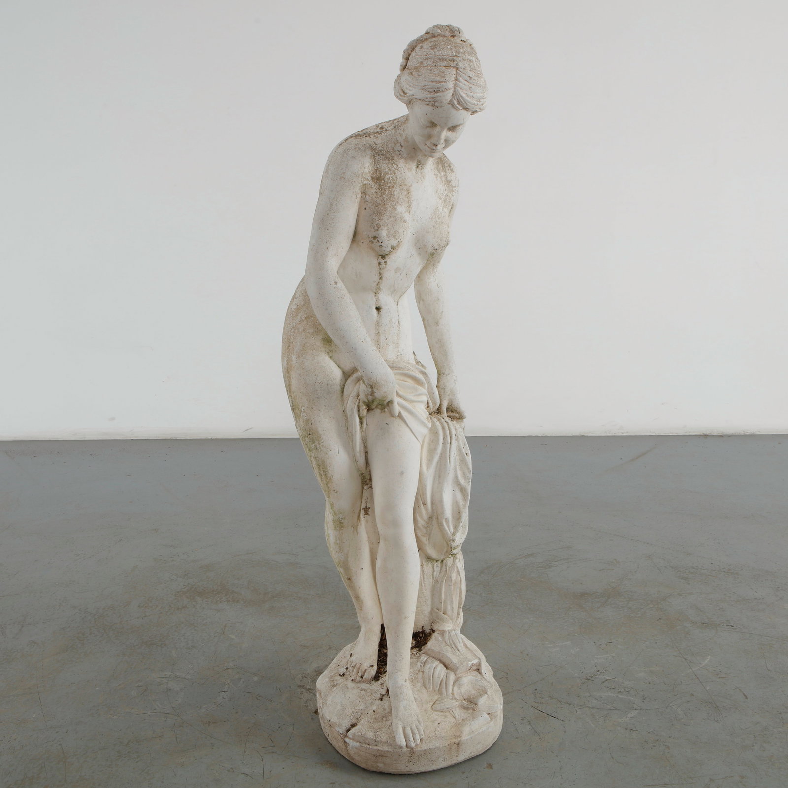 Classical Female Garden Statue, 1960s: This classical female garden statue is a beautifully executed mid-20th-century reproduction of the famous 1767 Rococo masterpiece Venus Sortant du Bain (Venus Emerging from the Bath or The Bather) by 