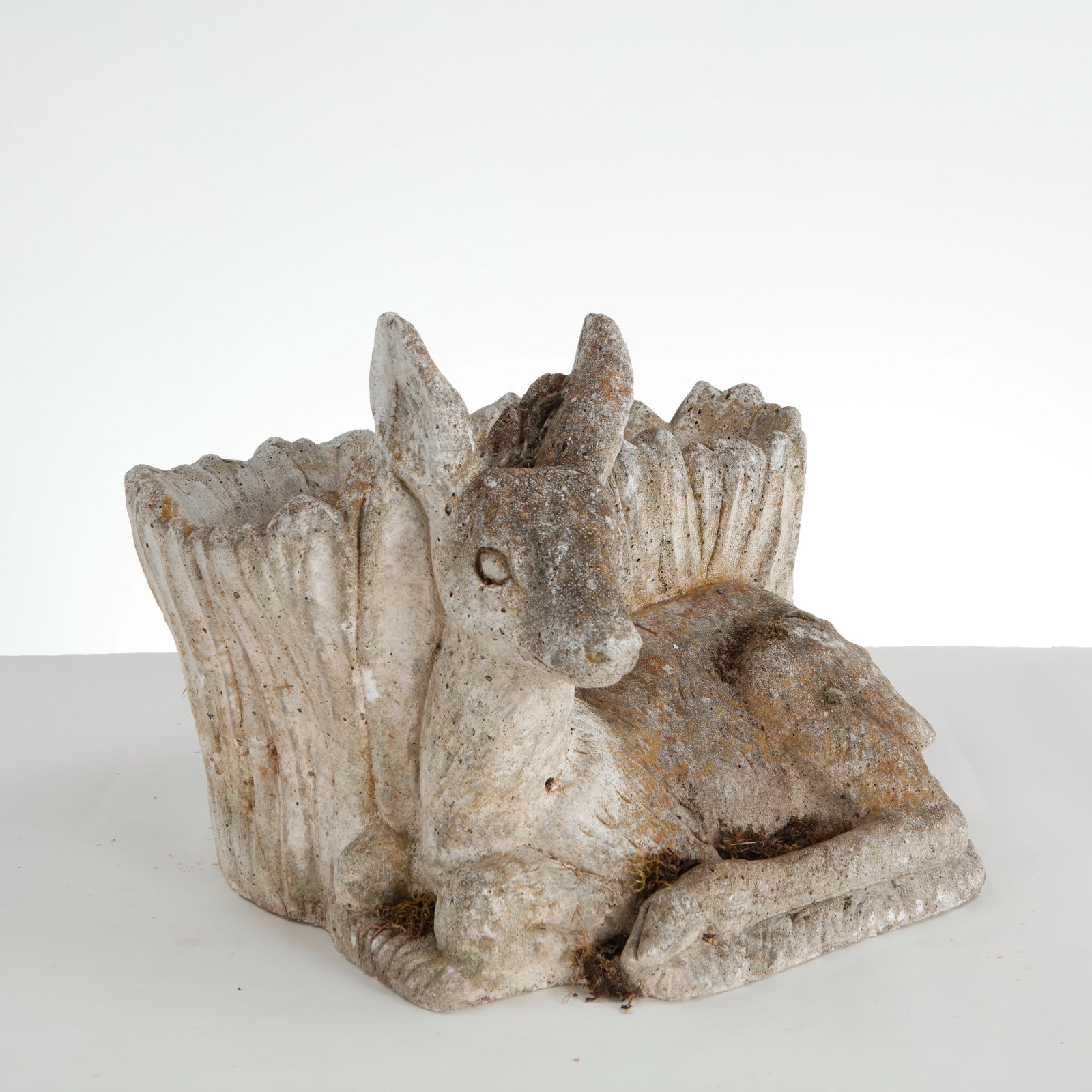 Sculptural Stone Fawn Planter, 1960s: This vintage cast stone fawn planter is a charming piece of mid-century figurative garden ornament. It beautifully combines whimsical animal sculpture with functional outdoor utility. Height: 9 in. Le