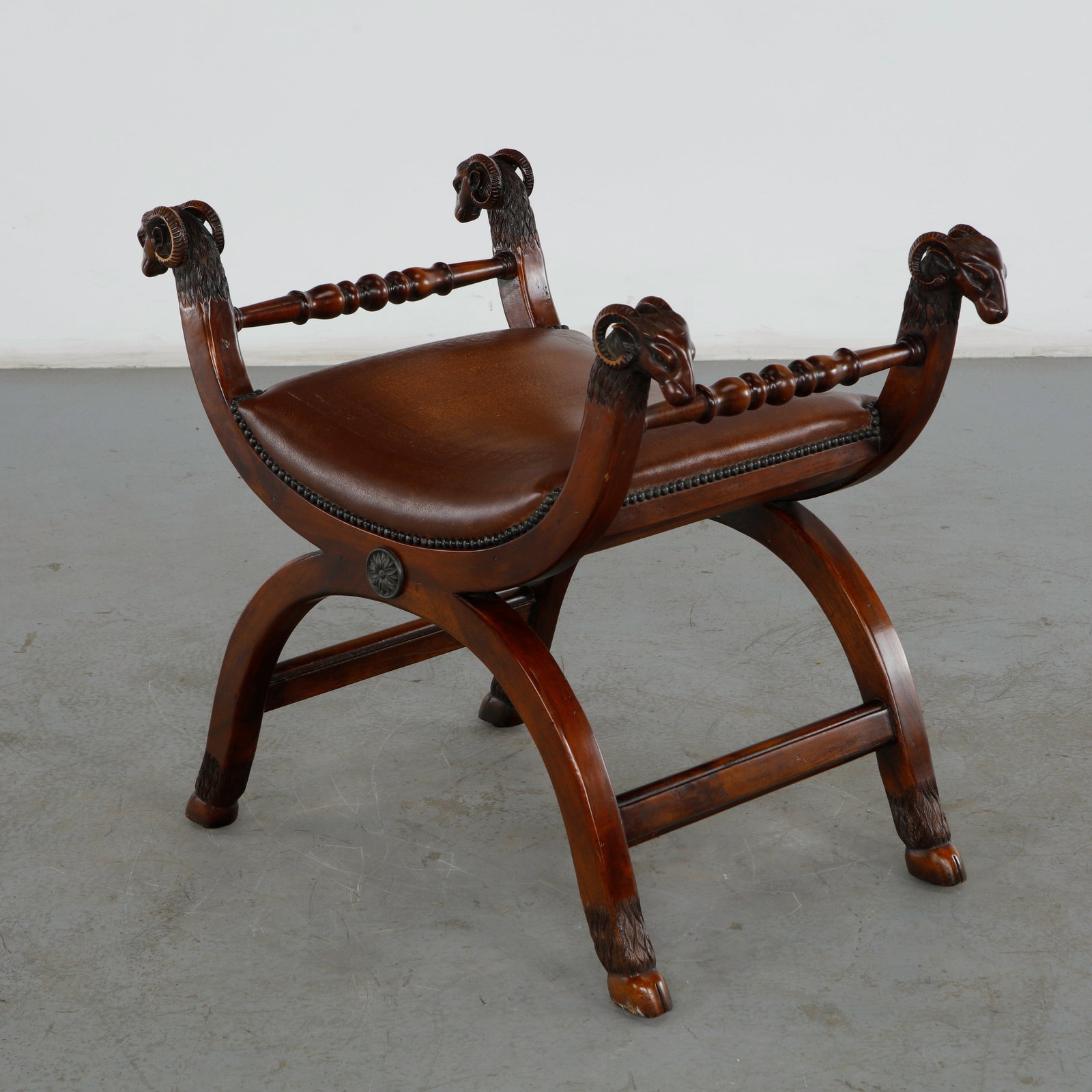 Theodore Alexander by Rams Head Regency Mahogany Bench: As an elegant entryway, vanity, or end-of-bed accent seating option, this high-end Theodore Alexander piece channels the classical curule form to serve as a striking statement piece. Height: 26 in. Le