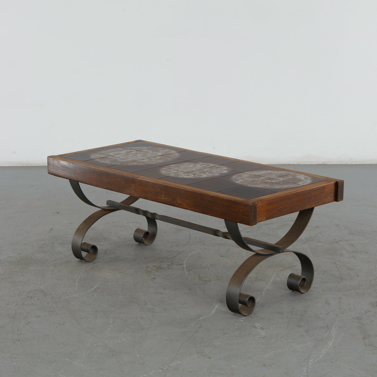Juliette Belarti, Ceramic Coffee Table, 1960s: This midcentury modern ceramic tile coffee table by Juliette Belarti from the 1960s is a classic example of Belgian and French brutalist-leaning design. It beautifully captures the period's love f