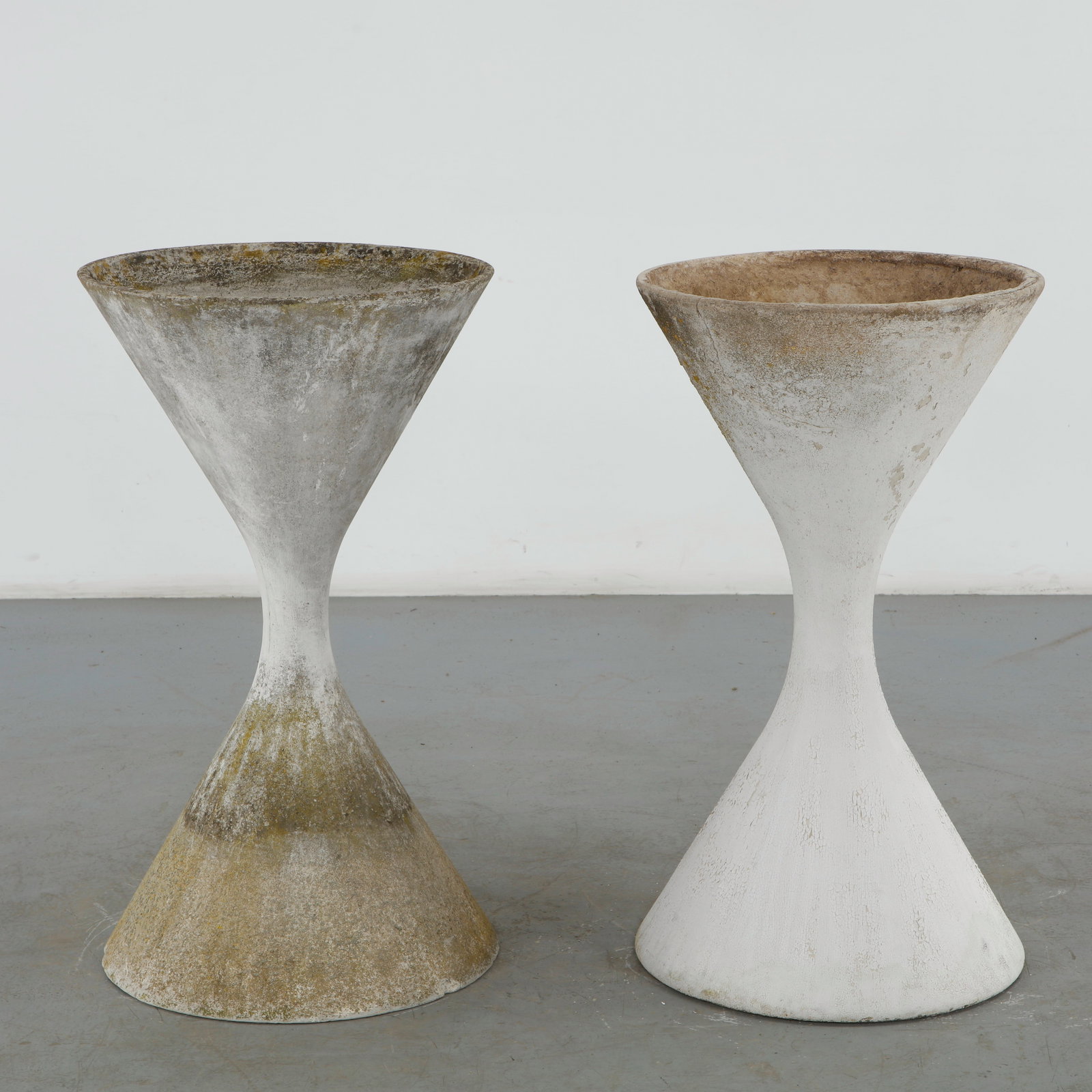 Willy Guhl, Pair of Large Diabolo Planters, 1960s: Pair of Willy Guhl large diabolo planters manufactured by Eternit, Switzerland. Height: 38 in. Diameter: 21.5 in. Condition Wear commensurate with age and evidence of outdoor use. Outdoo