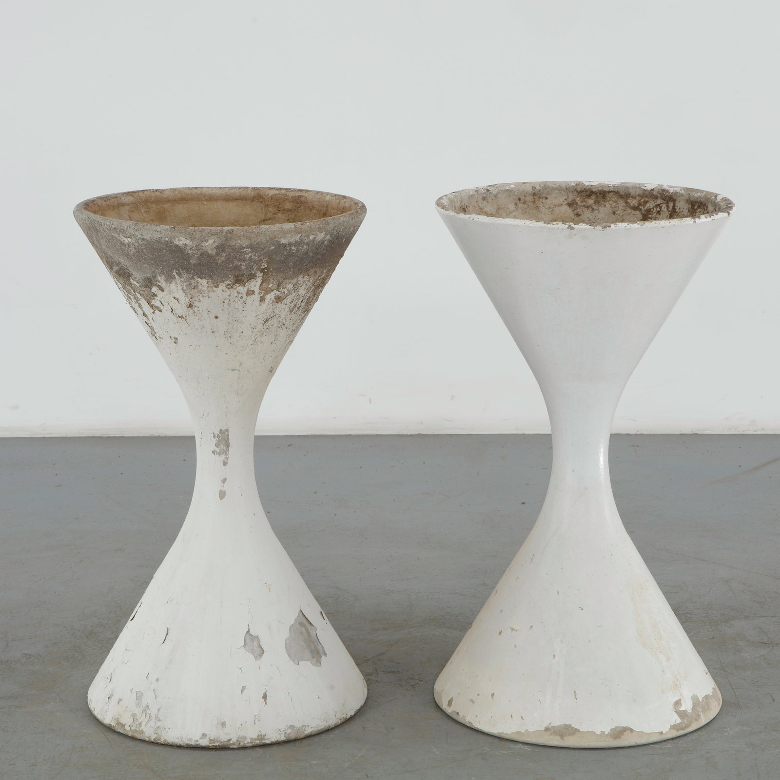 Willy Guhl, Pair of Large Diabolo Planters, 1960s: Pair of Willy Guhl large diabolo planters manufactured by Eternit, Switzerland. Height: 38 in. Diameter: 21.5 in. Condition Wear commensurate with age and evidence of outdoor use.