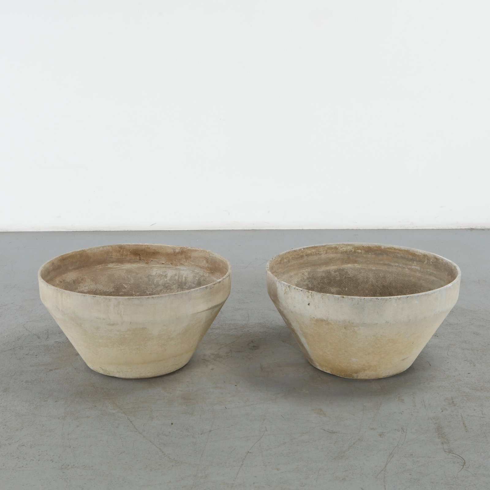 Willy Guhl, Pair of Large Conical Planters, 1960s: This pair of large conical planters by Willy Guhl is a masterclass in mid-century Swiss industrial design. Manufactured by the prominent Swiss firm Eternit circa 1960, these pieces embody the refined 
