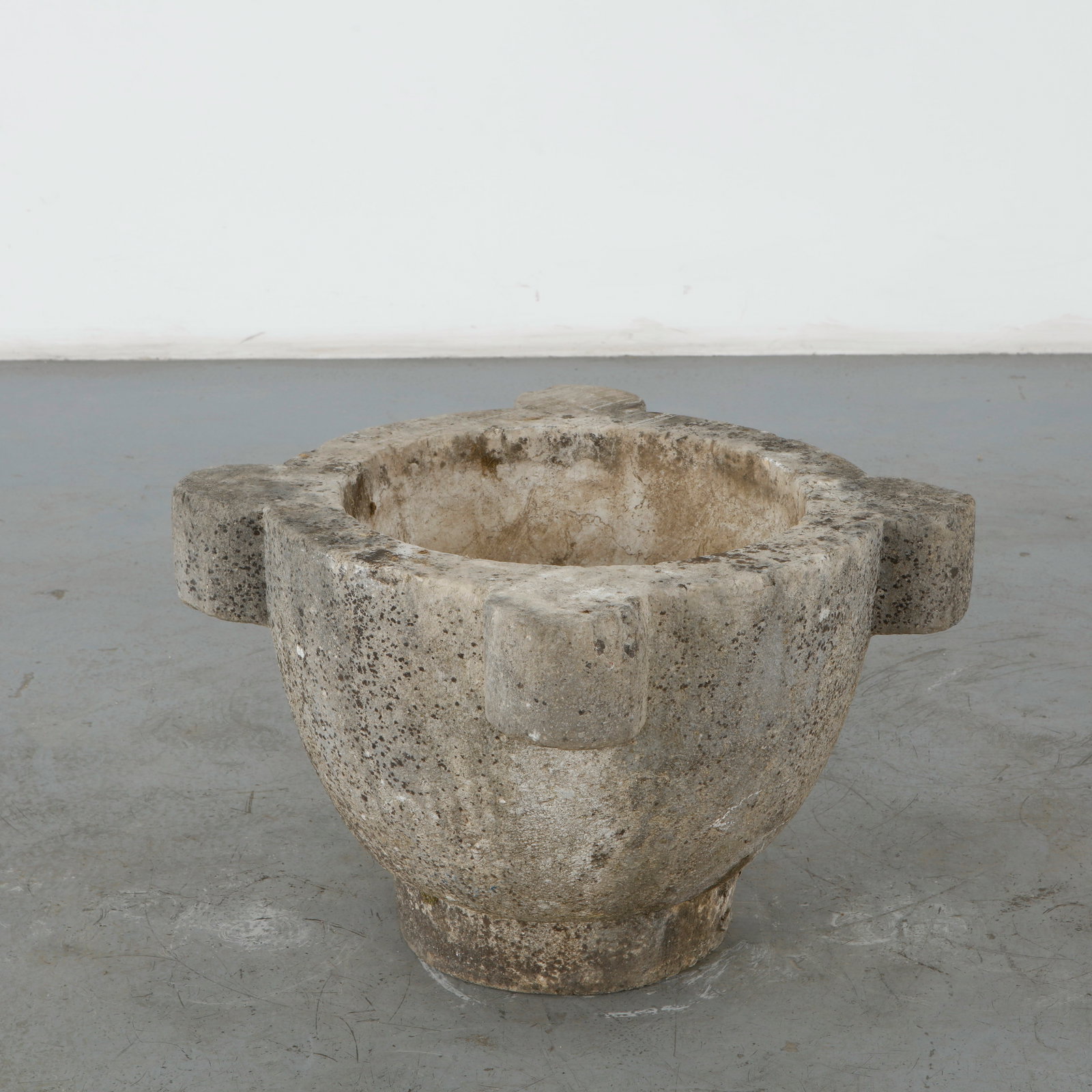 Monumental Urn Stone Planter, 1960s: A large cast stone urn planter with a classical silhouette, broad rim, and substantial rounded body. The richly weathered surface and natural oxidation impart an exceptional sense of age and