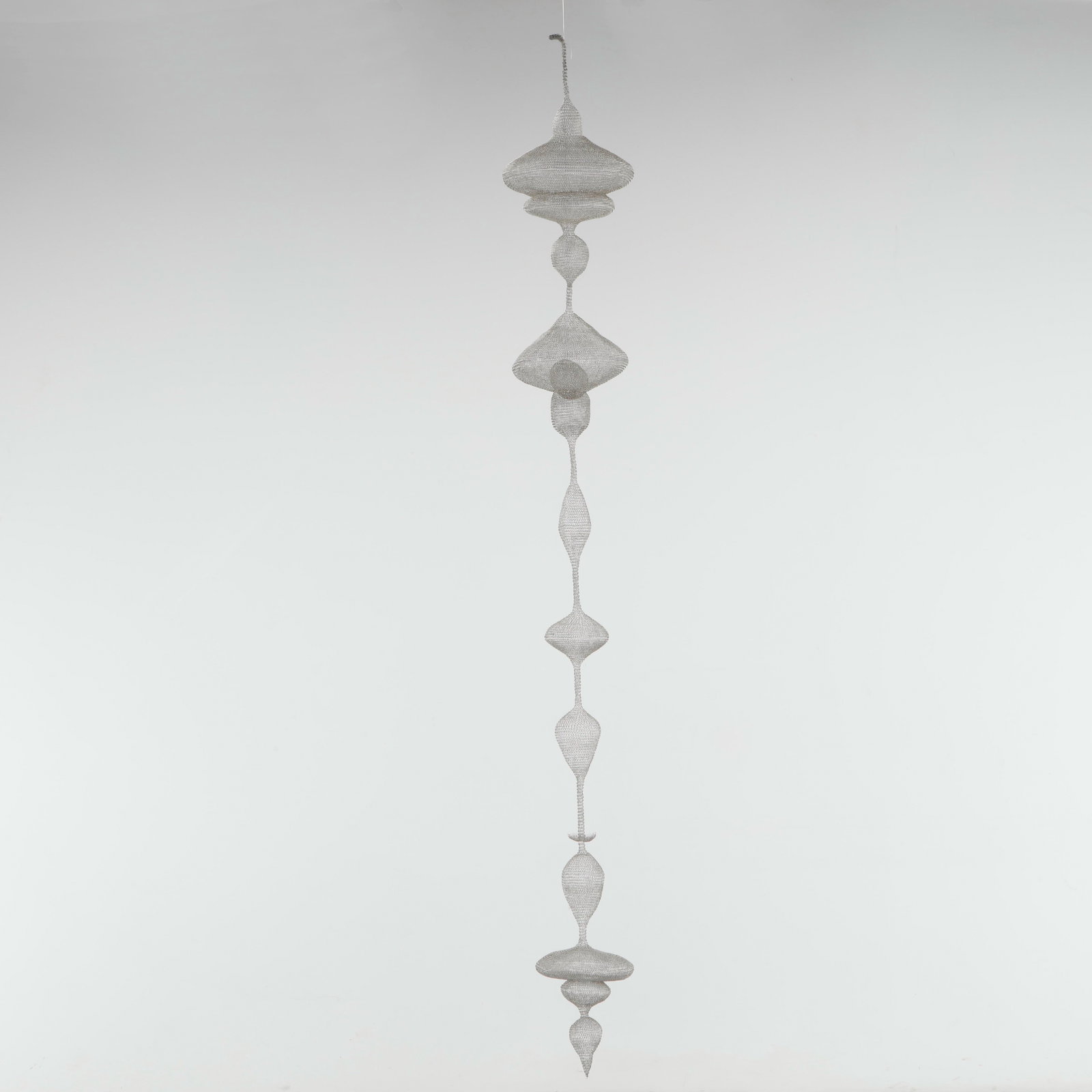 Wire Suspended Sculpture: Note from the artist: Eternal Love is a long-hanging sculpture that translates meaningful spoken words into form. Hand-crafted from stainless steel wire using wire looping techniques inspired by Ruth