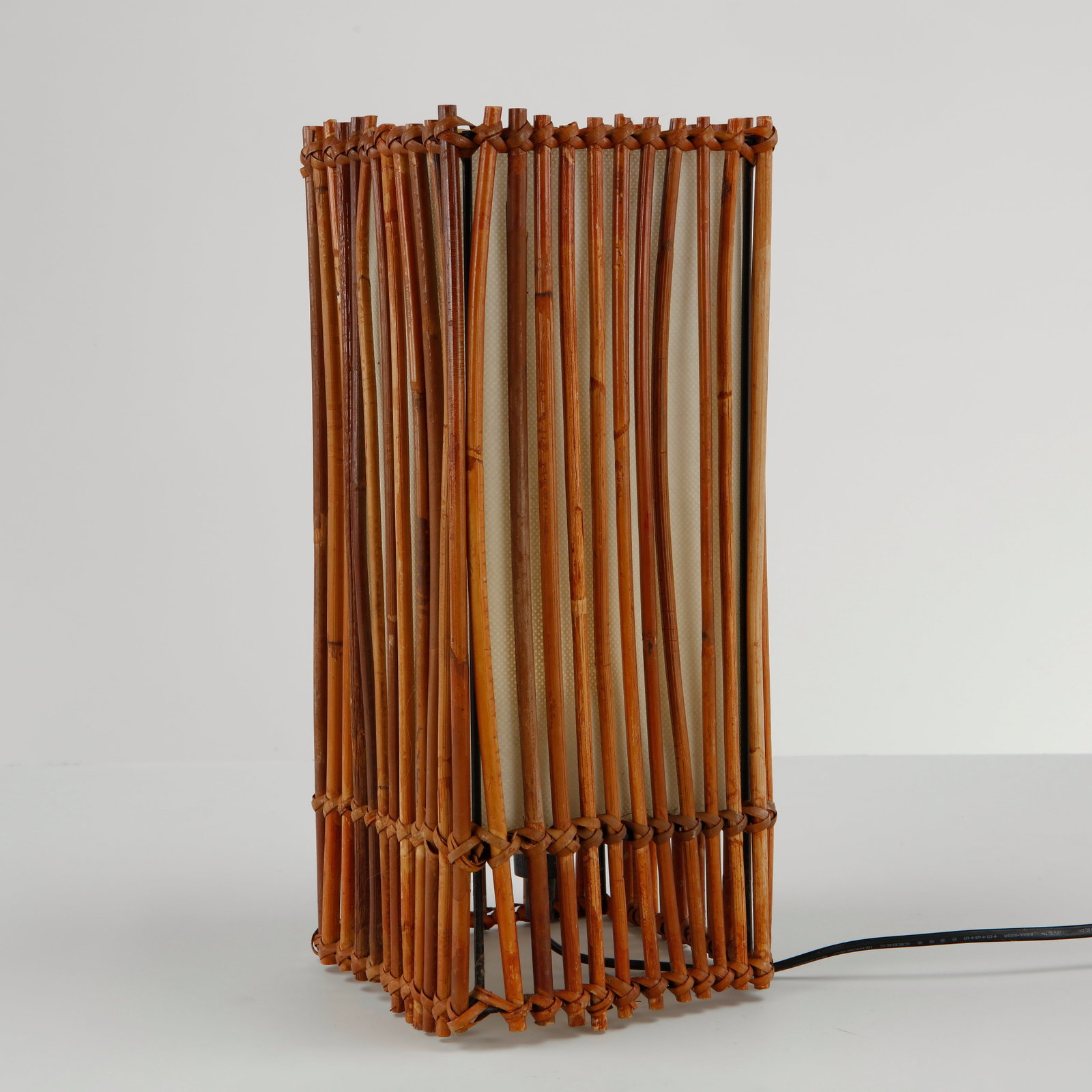 Louis Sognot, Rattan Rectangular Table Lamp, 1960s: This iconic lighting fixture is a vintage French Mid-Century Modern bamboo and rattan lantern table lamp, meticulously crafted in the distinctive style popularized by the pioneering French designer