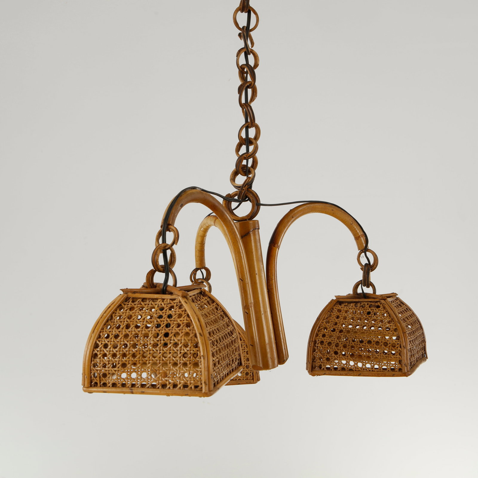 Louis Sognot, Three-Light Rattan Chandelier, 1950s: This exceptional lighting fixture is a vintage French Mid-Century Modern bamboo and rattan chandelier hanging pendant lamp, designed in the distinctive style pioneered by Louis Sognot during the
