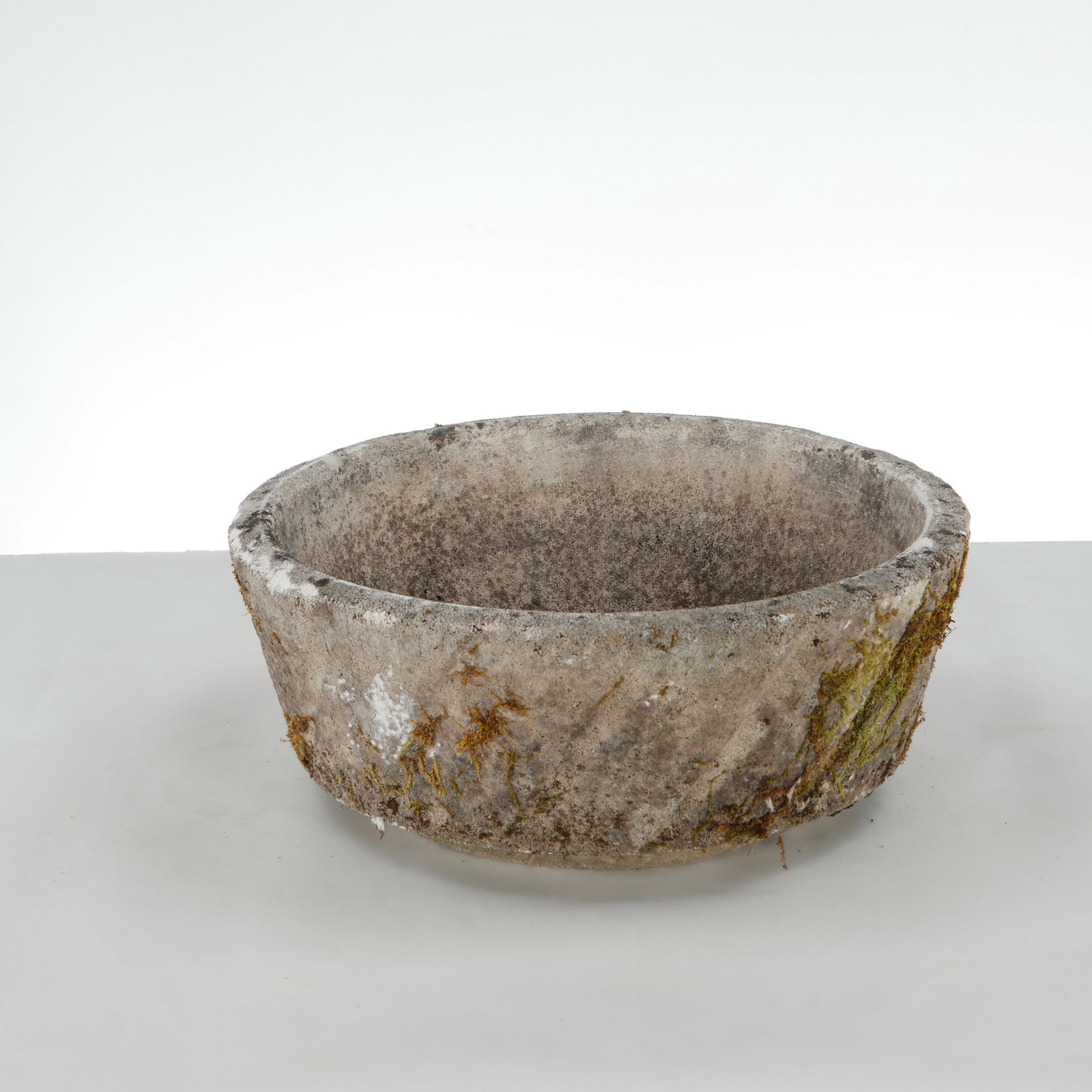 Round Stone Planter, 1960s: This brutalist round cast stone garden planter from the 1960s, showcasing a rugged, organic aesthetic that contrasts beautifully with mid-century minimalism. Height: 3.5 in. Diameter: 19.5 in. 