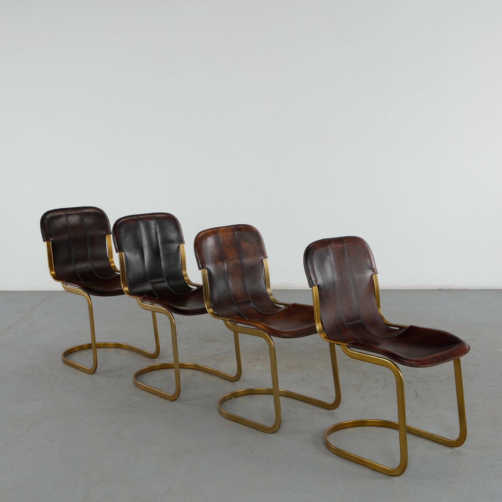 Willy Rizzo for Cidue, Set of Four Brass and Leather Dining Chairs, 1960s,: A rare and elegant set of four midcentury dining chairs designed by the celebrated Italian-French designer and photographer Willy Rizzo epitomizes the high-end, glamorous "Hollywood