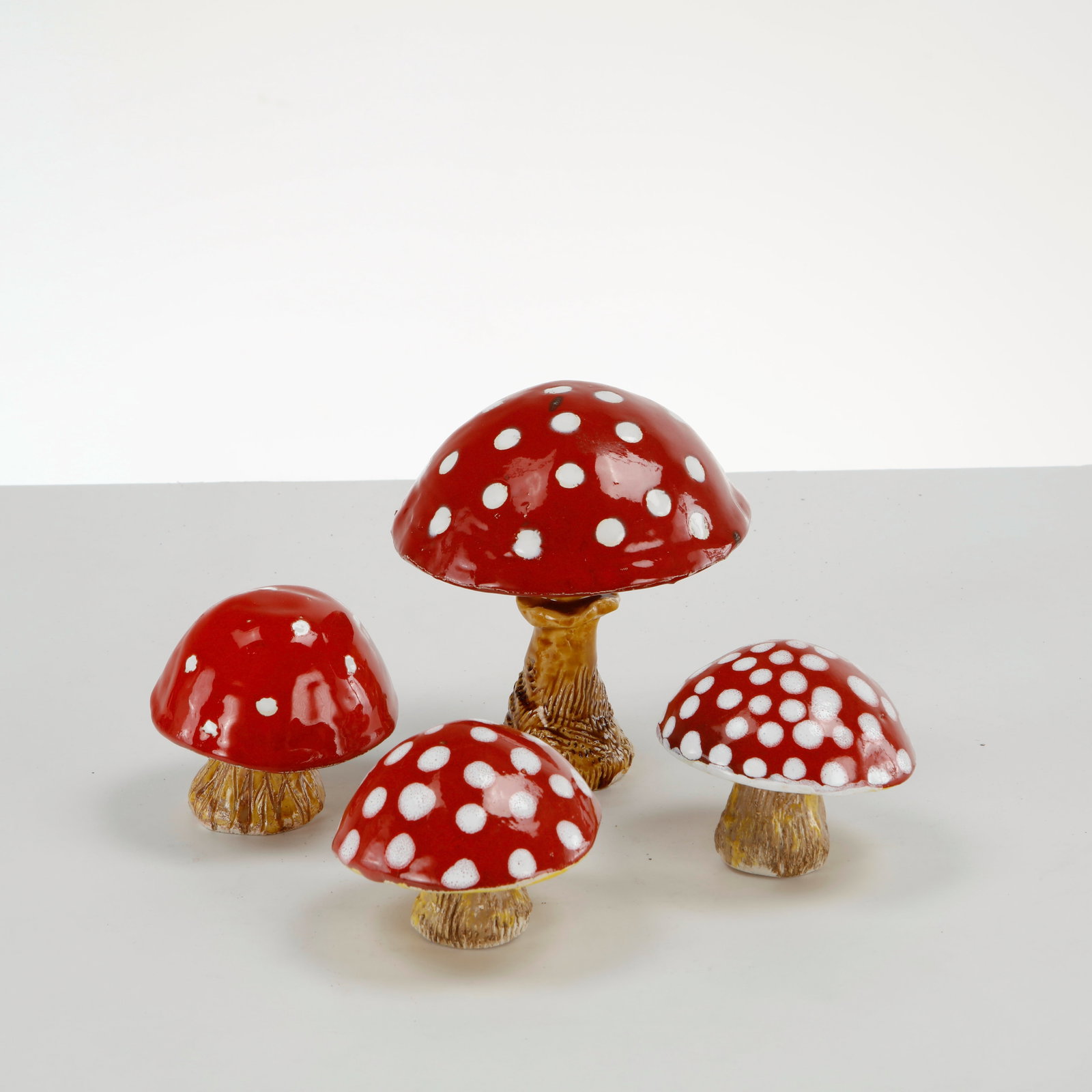 Set of Four Ceramic Mushroom Figures, 1960s: This set of 4 ceramic mushroom figurines is a charming collection of decorative garden or home accents designed to look like the iconic Amanita muscaria (fly agaric) mushroom. 1: Height:7 in.