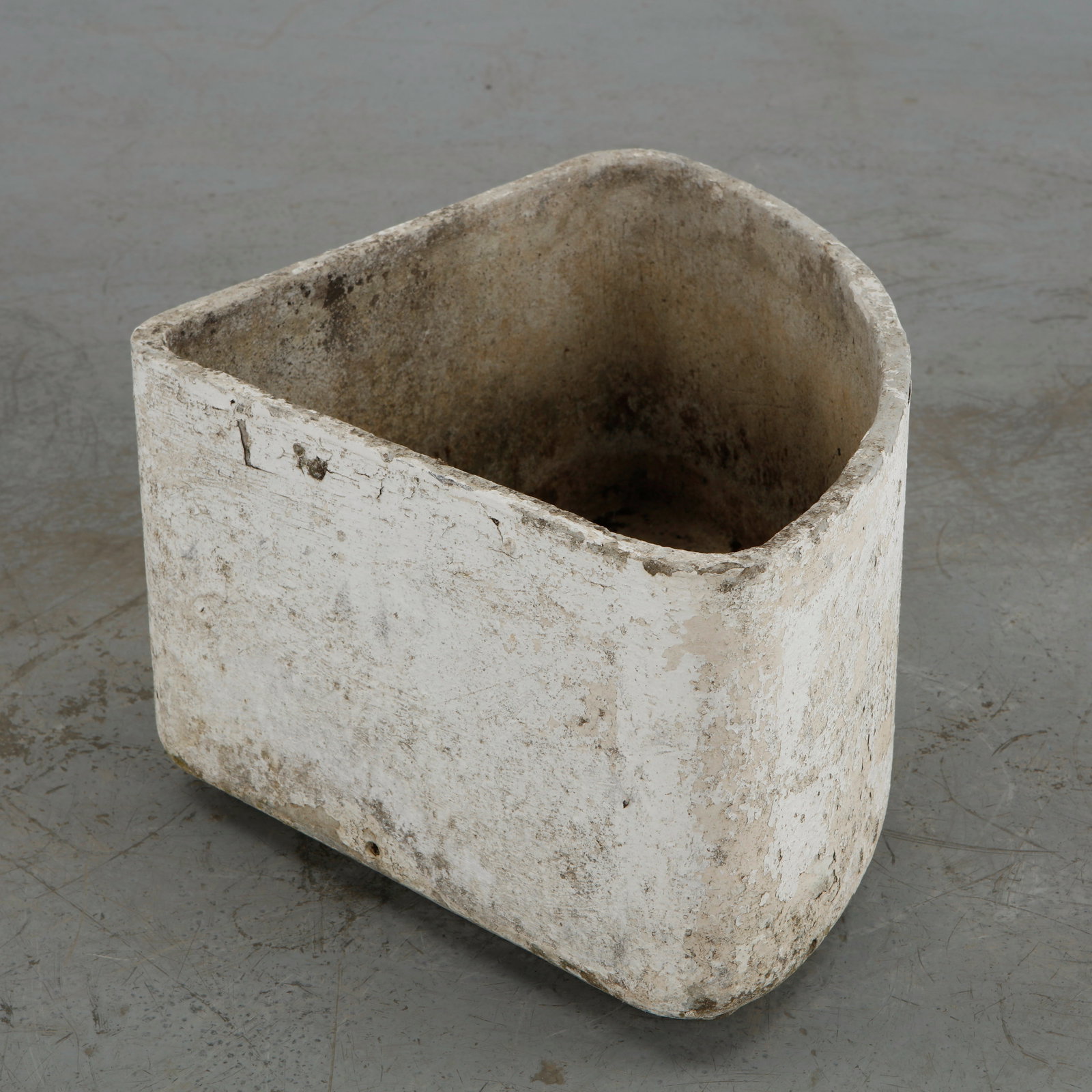 Willy Guhl, Triangular Planter, 1960s: This individual triangular corner planter from Willy Guhl's modular geometric series for Eternit features a distinct wedge or triangular silhouette with a broad, curved front face and two flat sides