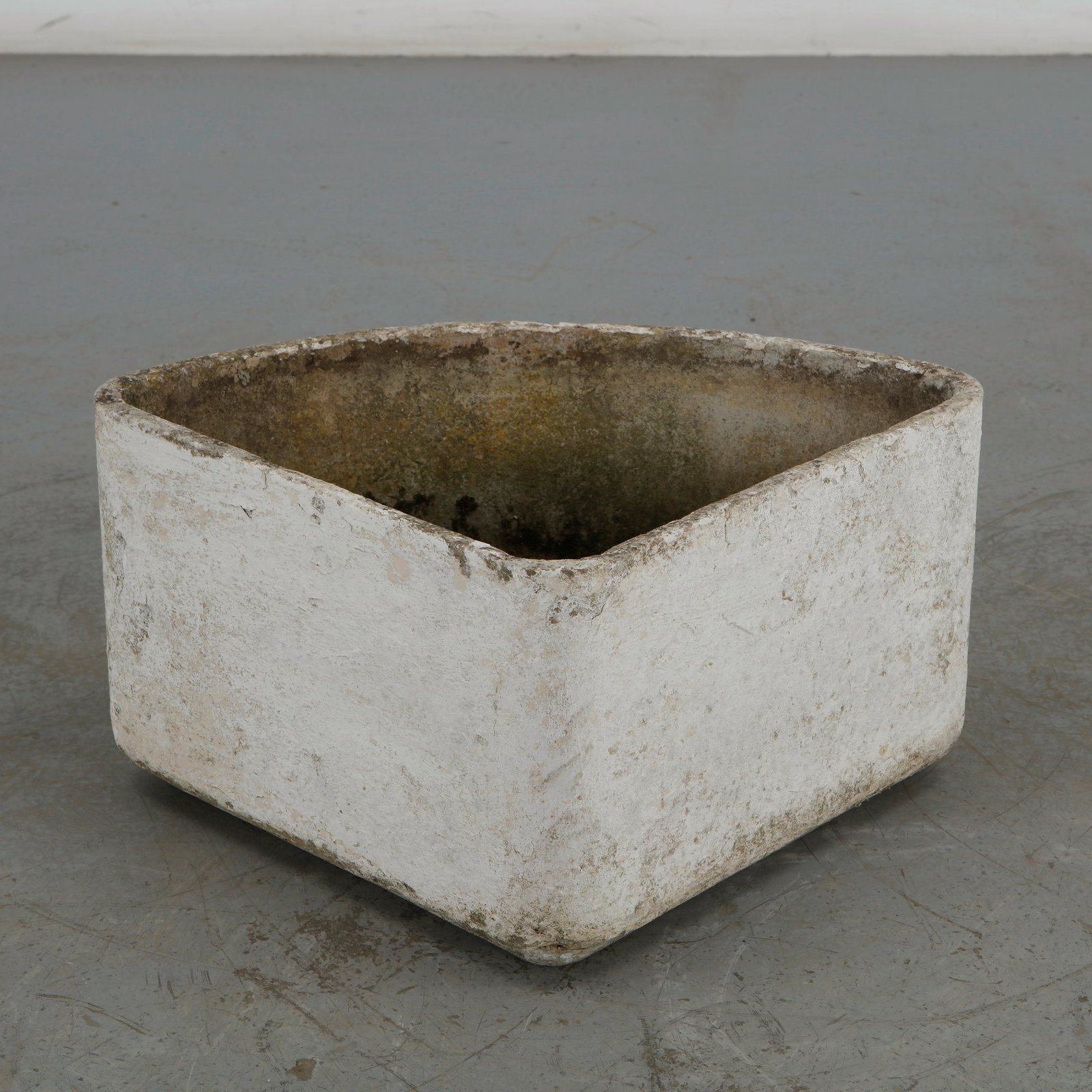 Willy Guhl, Triangular Planter, 1960s: This individual triangular corner planter from Willy Guhl's modular geometric series for Eternit features a distinct wedge or triangular silhouette with a broad, curved front face and two flat sides