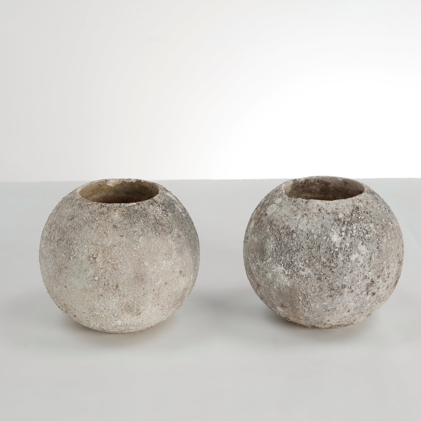 Grandon Fres, Pair of extra small Spherical Planters, 1960s: Pair of spherical planters with textured surface. Sculptural outdoor statement pieces by Grandon Fres. Height: 6 in. Diameter: 6 in. Opening Diameter: 3 in. ConditionWear commensurate with age and