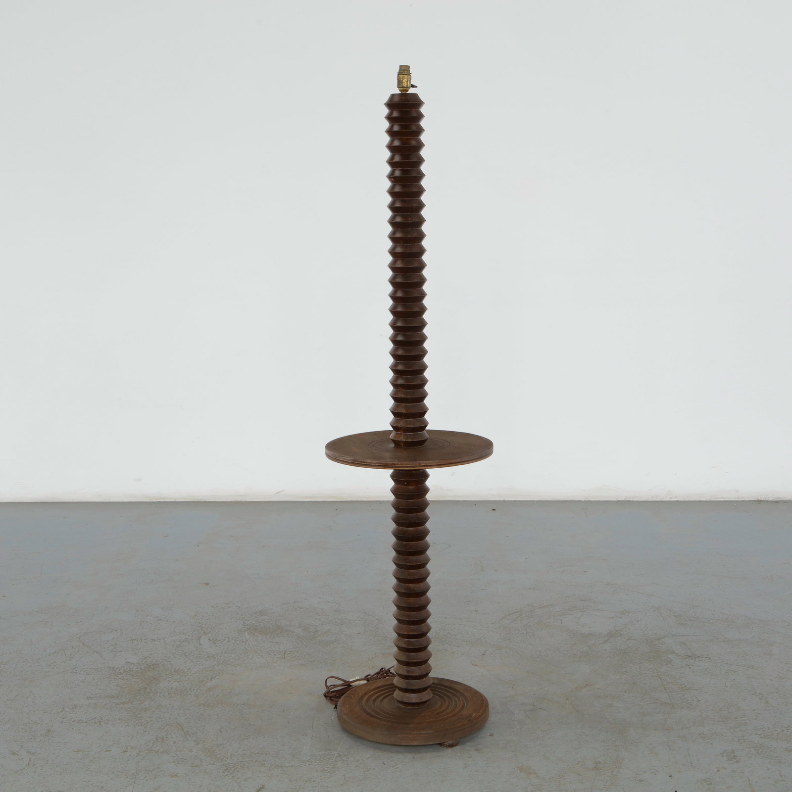 Charles Dudouyt, Carved Wood Floor Lamp, 1940s: Highly sought after for its robust, architectural presence and exceptional craftsmanship this floor lamp by Charles Dudouyt highlights his iconic mix of rustic character and strict geometric symmetry.
