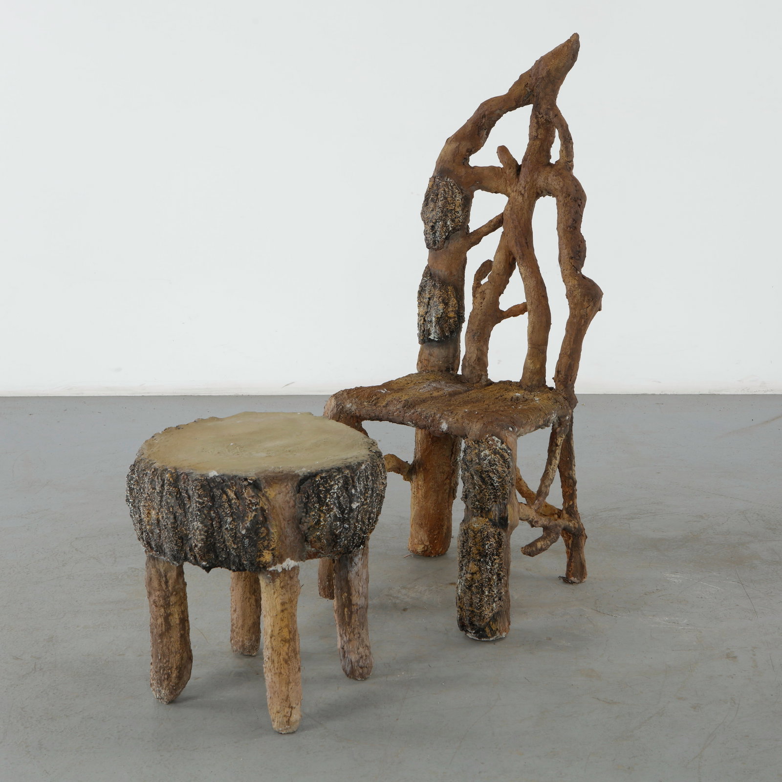 Faux Bois Concrete Chair and Side Table, France, 1960s: This French faux bois concrete chair and side table set, dating to circa 1960s, is an extraordinary representation of the rustic European "false wood" art form translated through a mid-century brutali