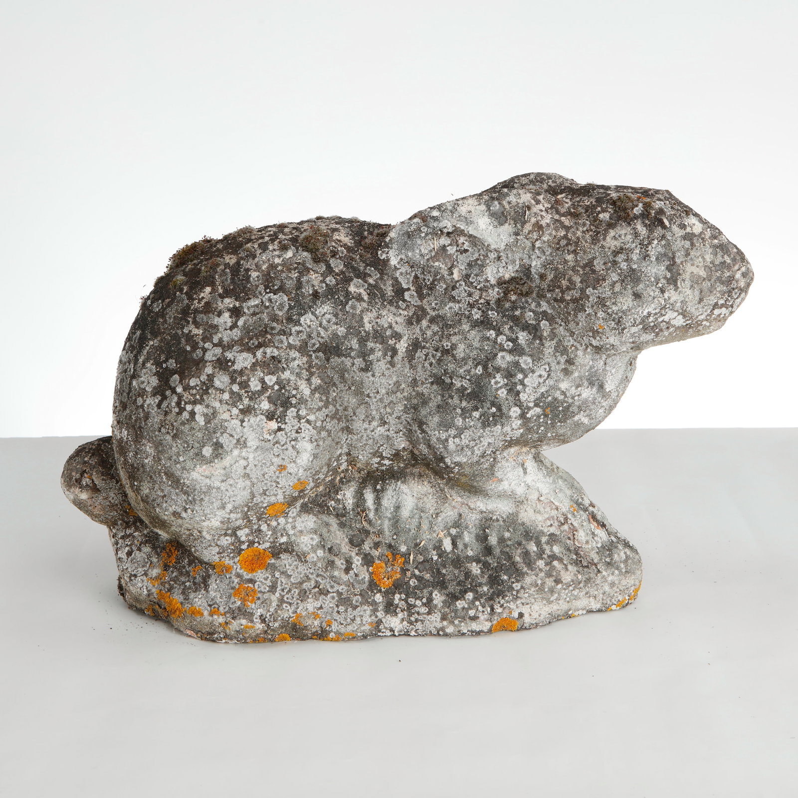 Stone Rabbit Garden Sculpture, 1960s: This vintage cast stone rabbit garden sculpture is a wonderful example of mid-20th-century weathered folk art garden ornamentation. It features a heavily textured, organic presence that seamlessly ble