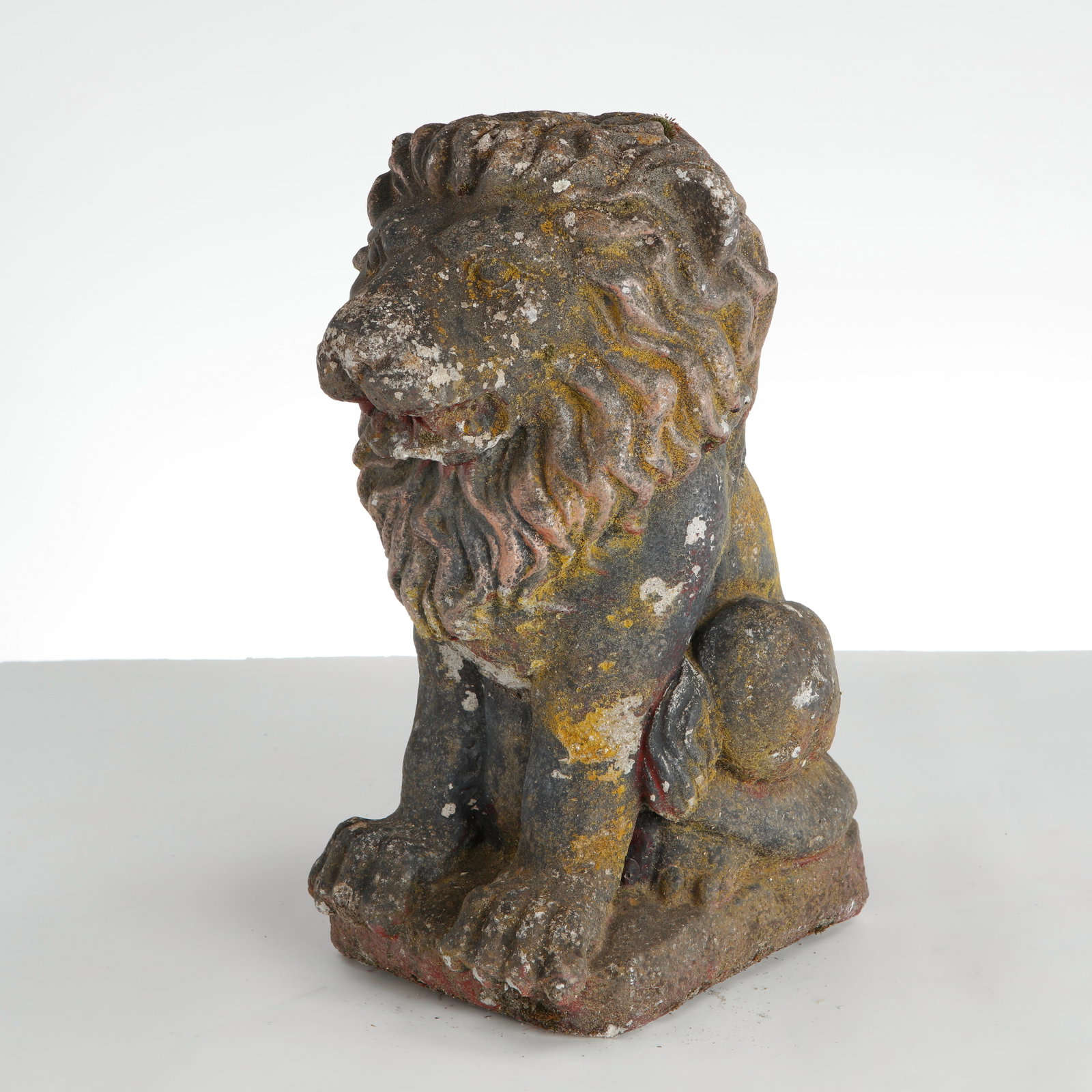 Sculptural Stone Lion Garden Sculpture, 1960s: This vintage cast stone sejant lion garden sculpture, dating from the 1960s, is a regal and character-rich piece of mid-century outdoor art. It blends classical heraldic imagery with a delightfully we