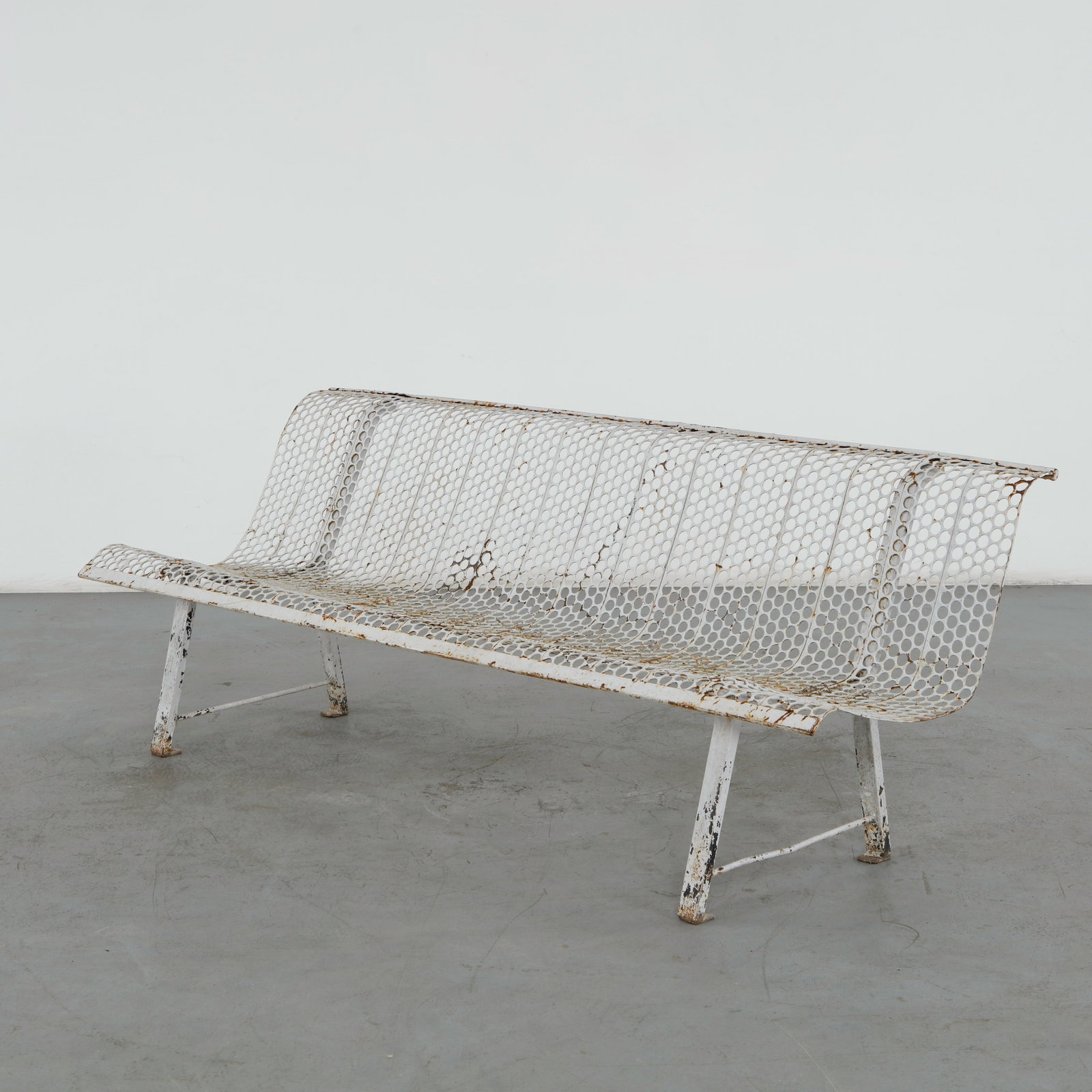 Rene Malaval, Perforated Metal Bench, 1950s: Rare French outdoor bench by Rene Malaval, executed in perforated painted metal with a graceful continuous structure. The restrained industrial construction and airy perforated surfaces exemplify the 