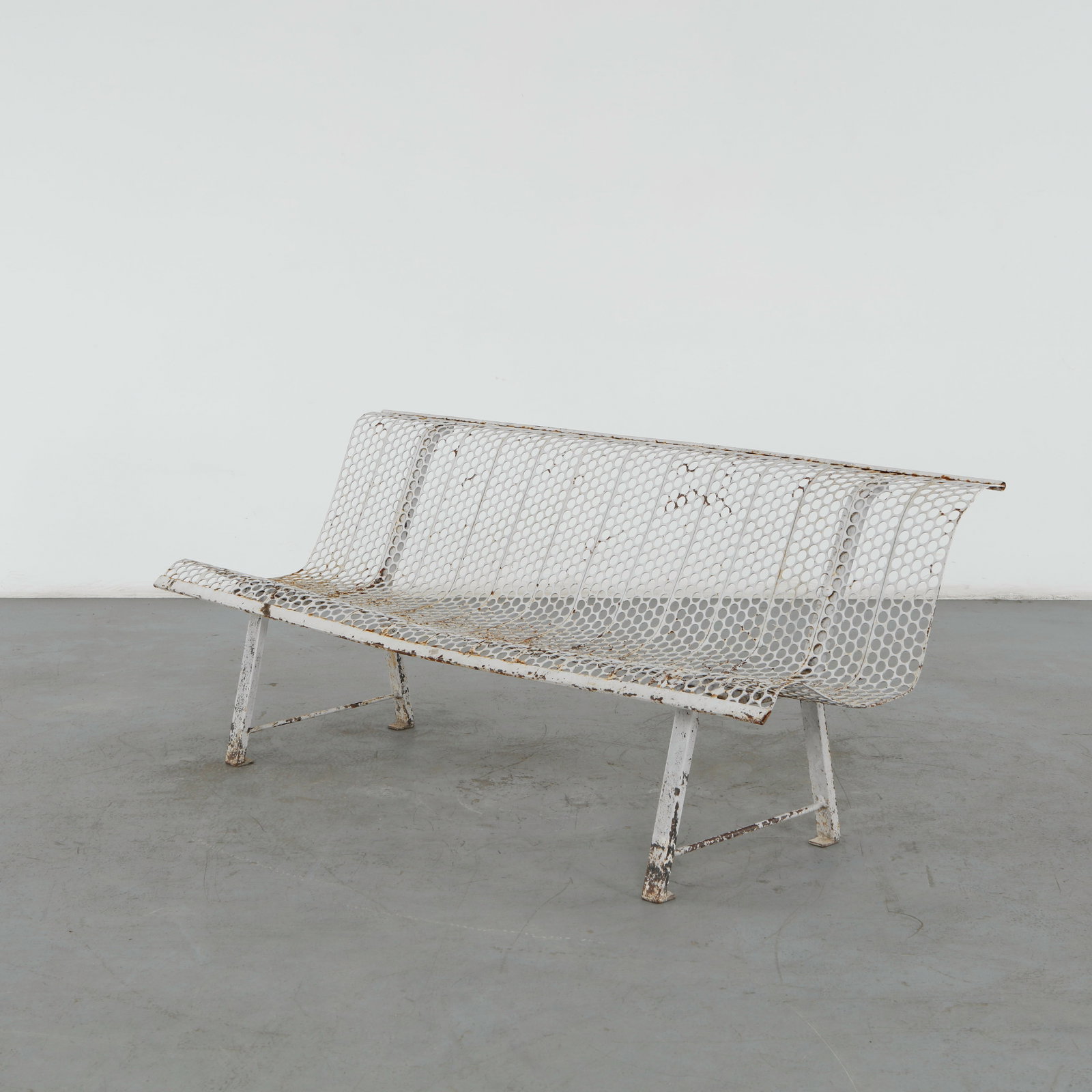 Rene Malaval, Perforated Metal Bench, 1950s: Rare French outdoor bench by Rene Malaval, executed in perforated painted metal with a graceful continuous structure. The restrained industrial construction and airy perforated surfaces exemplify the 