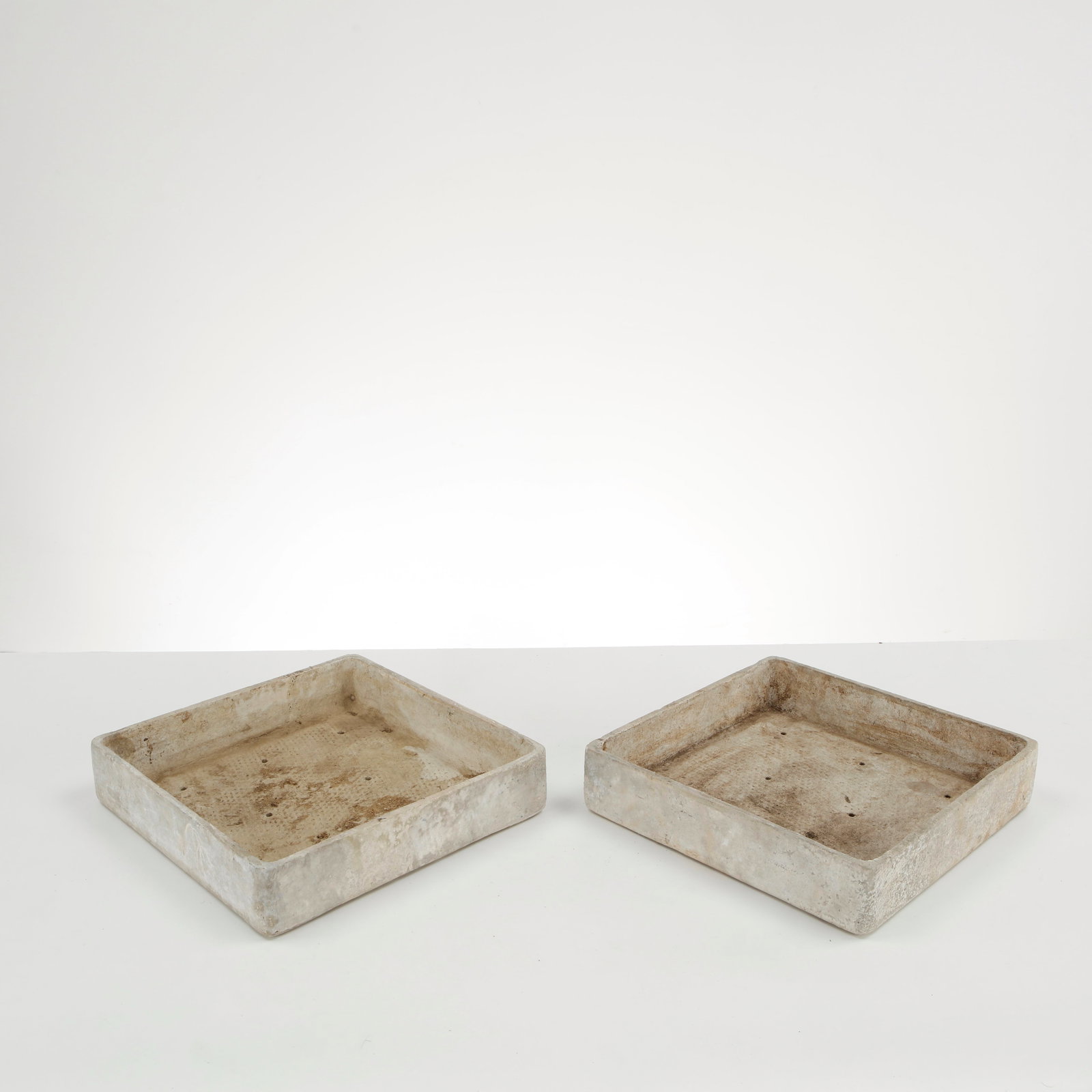 Willy Guhl, Pair of Square Tray Planters, 1960s: Rare pair of square Eternit tray planters designed by Willy Guhl, executed in fiber cement with clean geometric proportions and softened edges. Their restrained architectural form and naturally