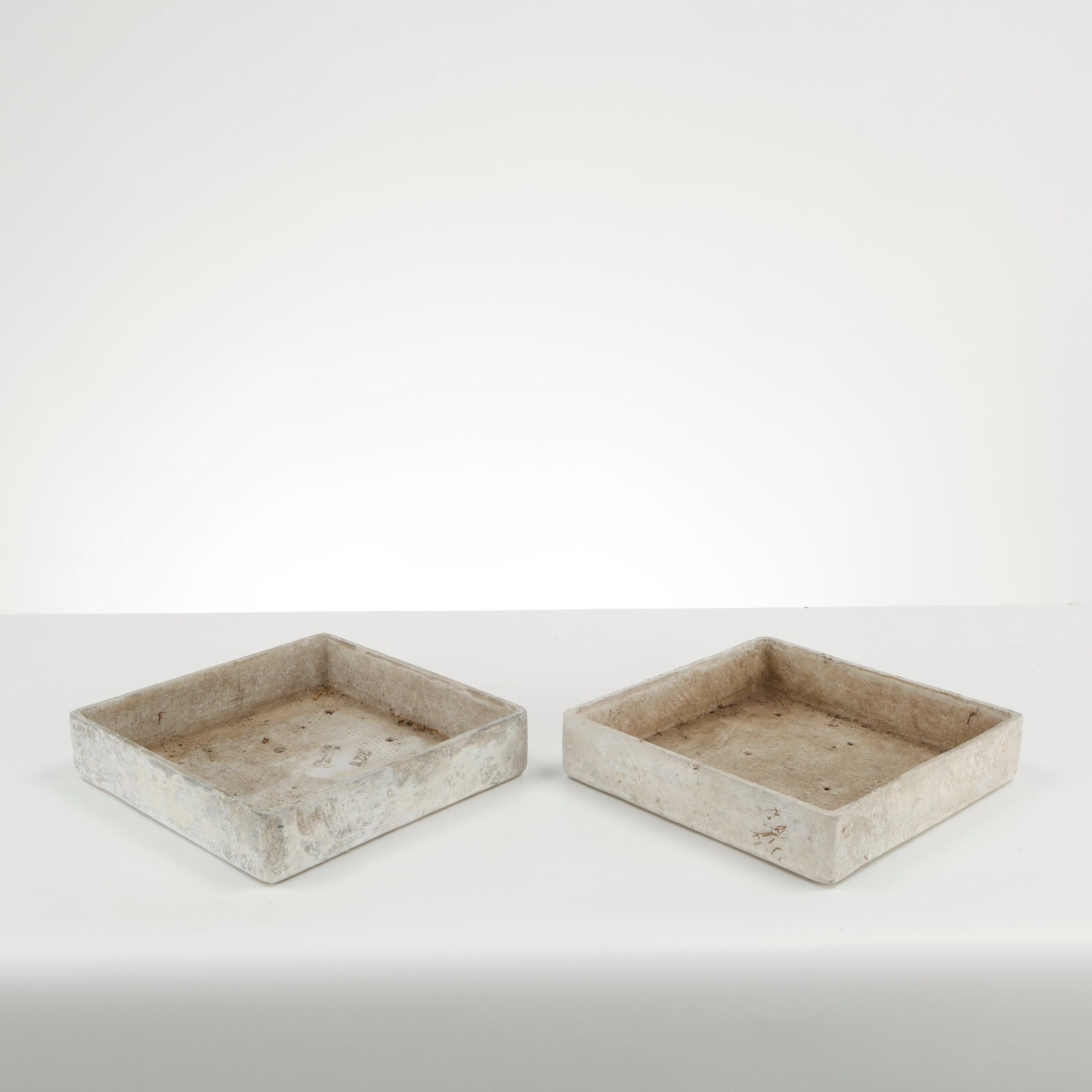Willy Guhl, Pair of Square Tray Planters, 1960s: Rare pair of square Eternit tray planters designed by Willy Guhl, executed in fiber cement with clean geometric proportions and softened edges. Their restrained architectural form and naturally
