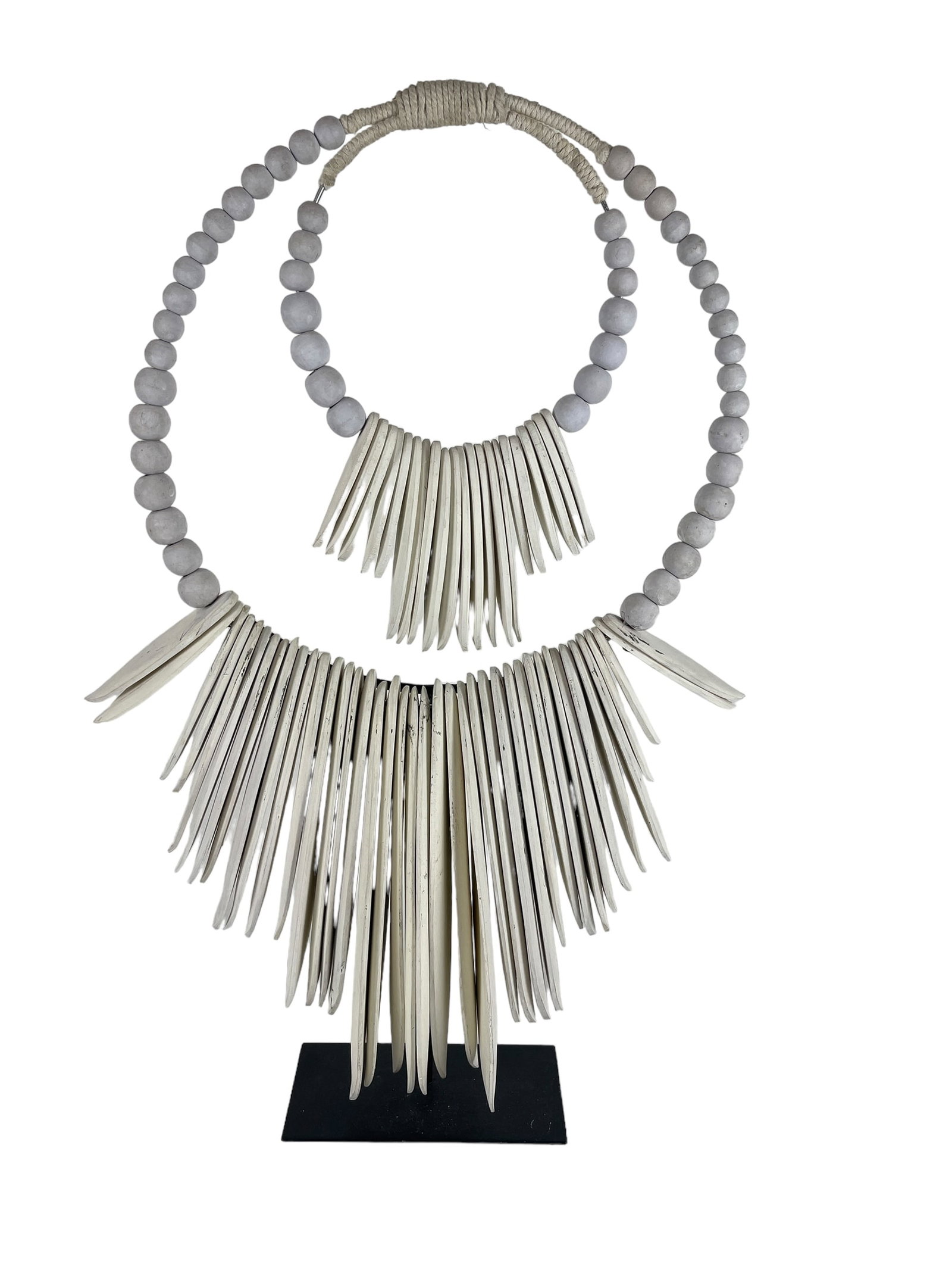 Statement Cuttle Shell Collar: 25”H with stand x 13.5”W approx. African tribal jewelry has become a very popular choice for many artists and collectors for its rare natural beauty. This stunning piece has been made by p