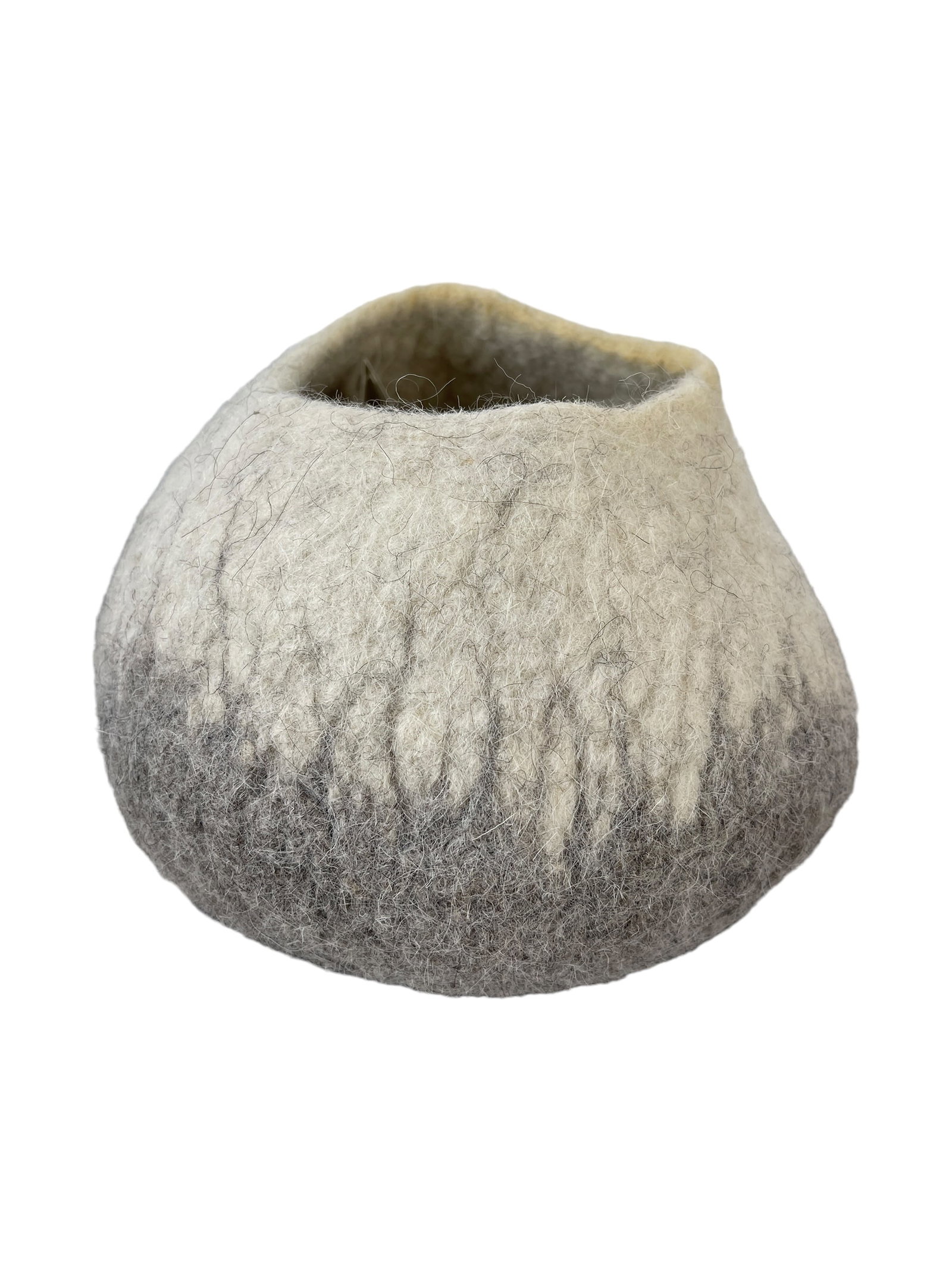 100% Wool Small Basket, Vase or Vessel: 7.5"H x approx 8.5"W. Made in South Africa. Designed by Ryazan Jakoet. Merino and Karakul wool. The Karakul Sheep known for its hardiness and ability to thrive under adverse conditions.