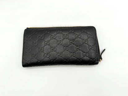 Gucci GG Marmont Zip Long Wallet: Brand: Gucci. Type: Long wallet. Material: Leather. Leather Color: Black. Size: length 7.5in width 4in.