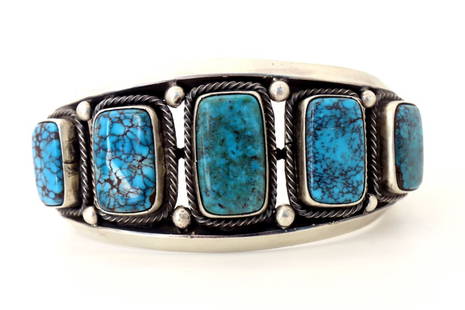 Navajo Silversmith Bobby Begay Turquoise Cuff: Navajo master silversmith Bobby Begay AAA lander blue turquoise sterling silver cuff with (5) stones center stone L 7/8" x 1/2 w tapering to L 3/4" x 3/8" w size 7. Gap 1 1/2". Bracelet width 1 1/2",